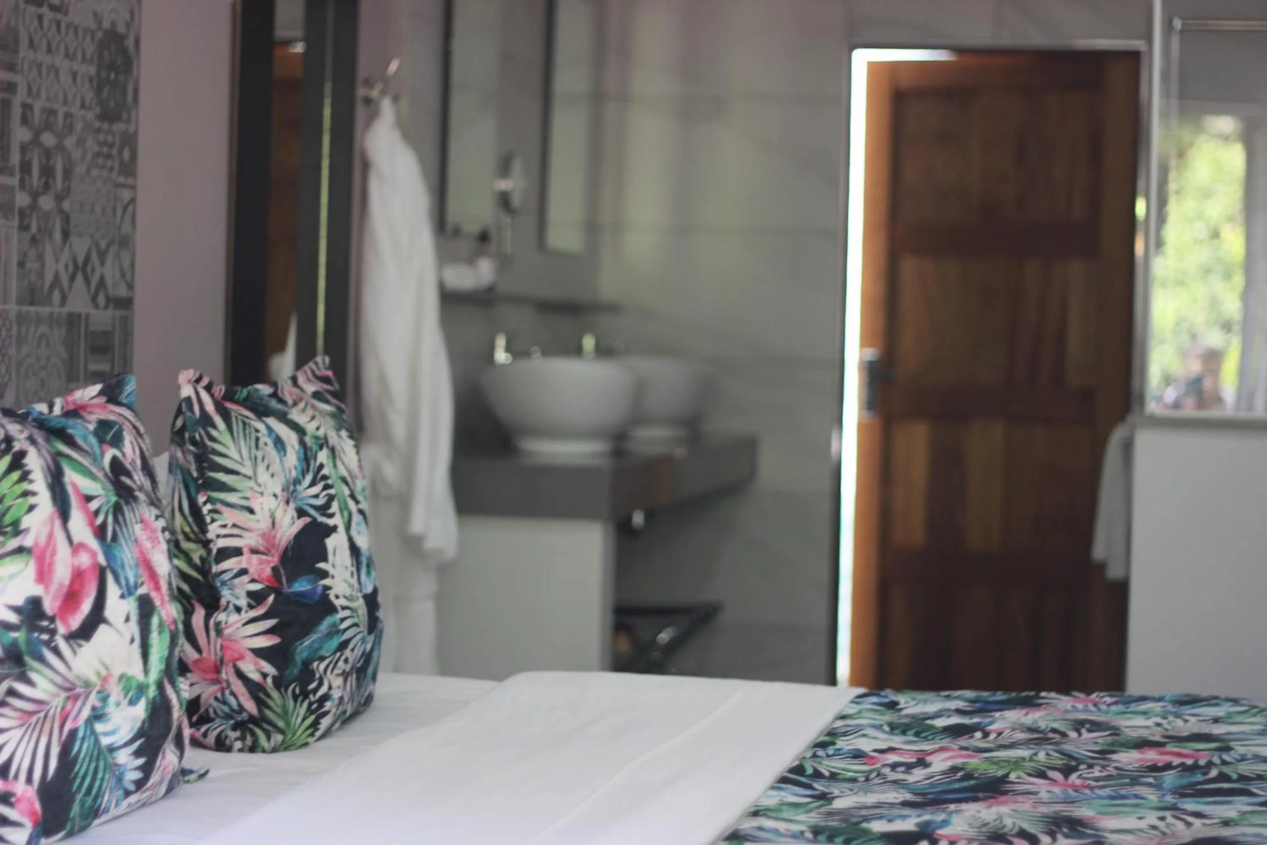 Bed in Ecolux Boutique Hotel