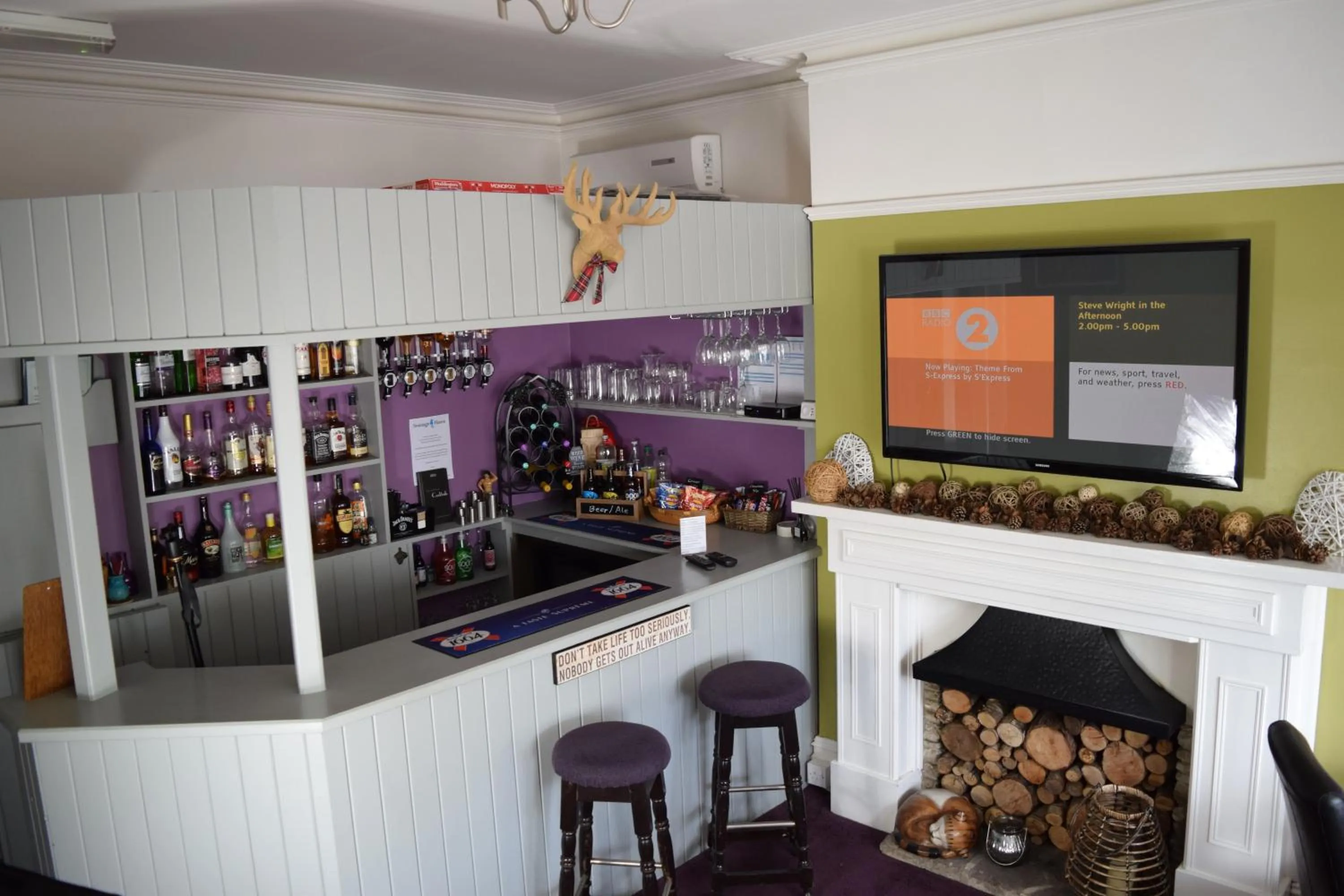 Communal lounge/ TV room in Swanage Haven Boutique Guest House