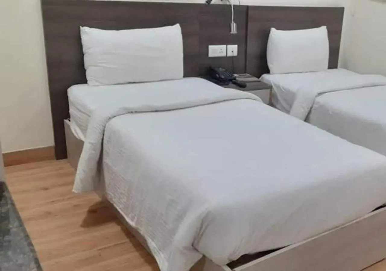 Bed in Hyphen Business Hotel