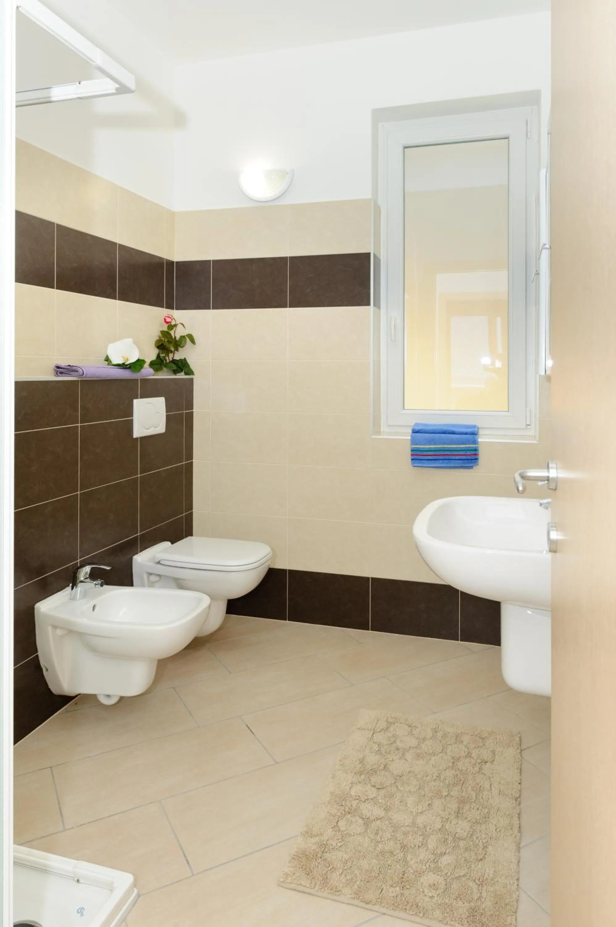 Bathroom in Residence Le Azalee & SPA