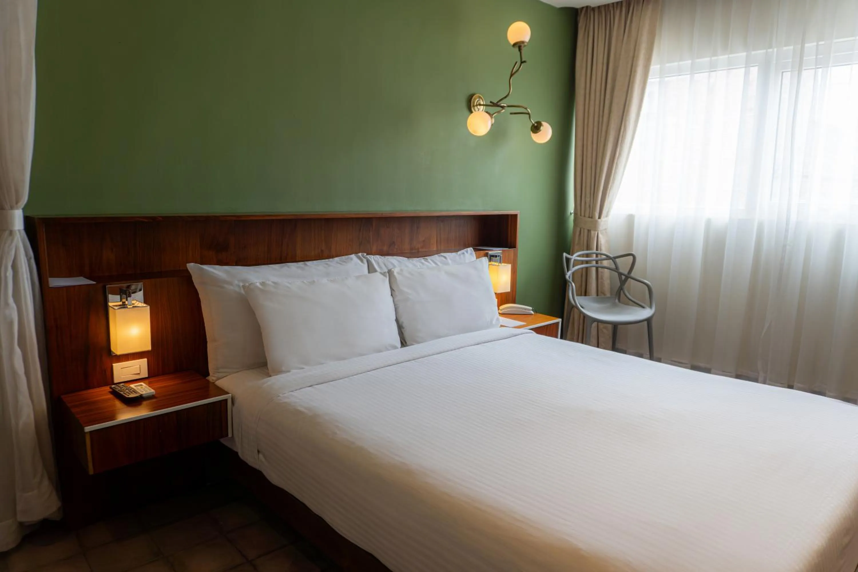 Bed in Flor de Mayo Hotel & Restaurant