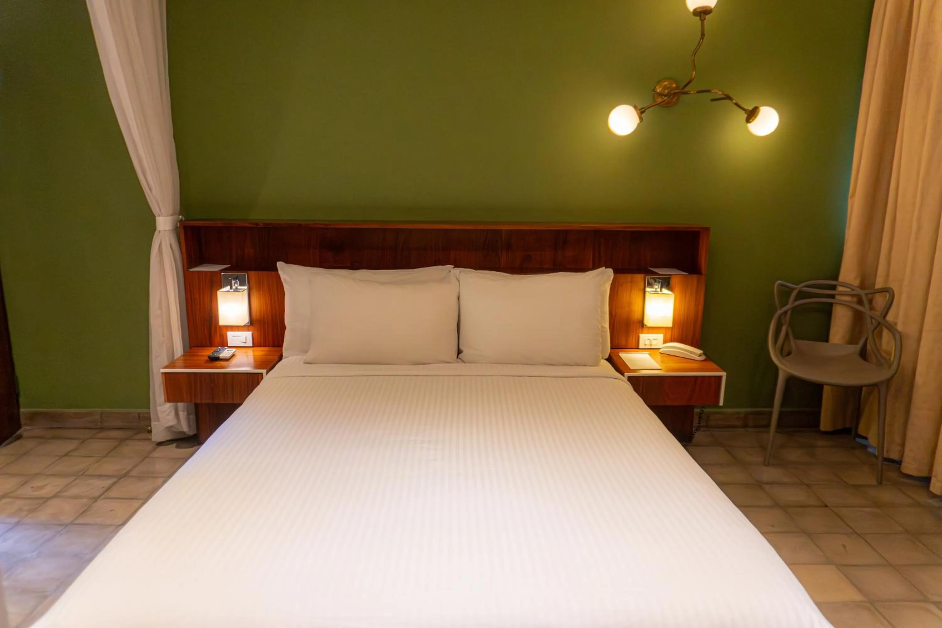 Bed in Flor de Mayo Hotel & Restaurant