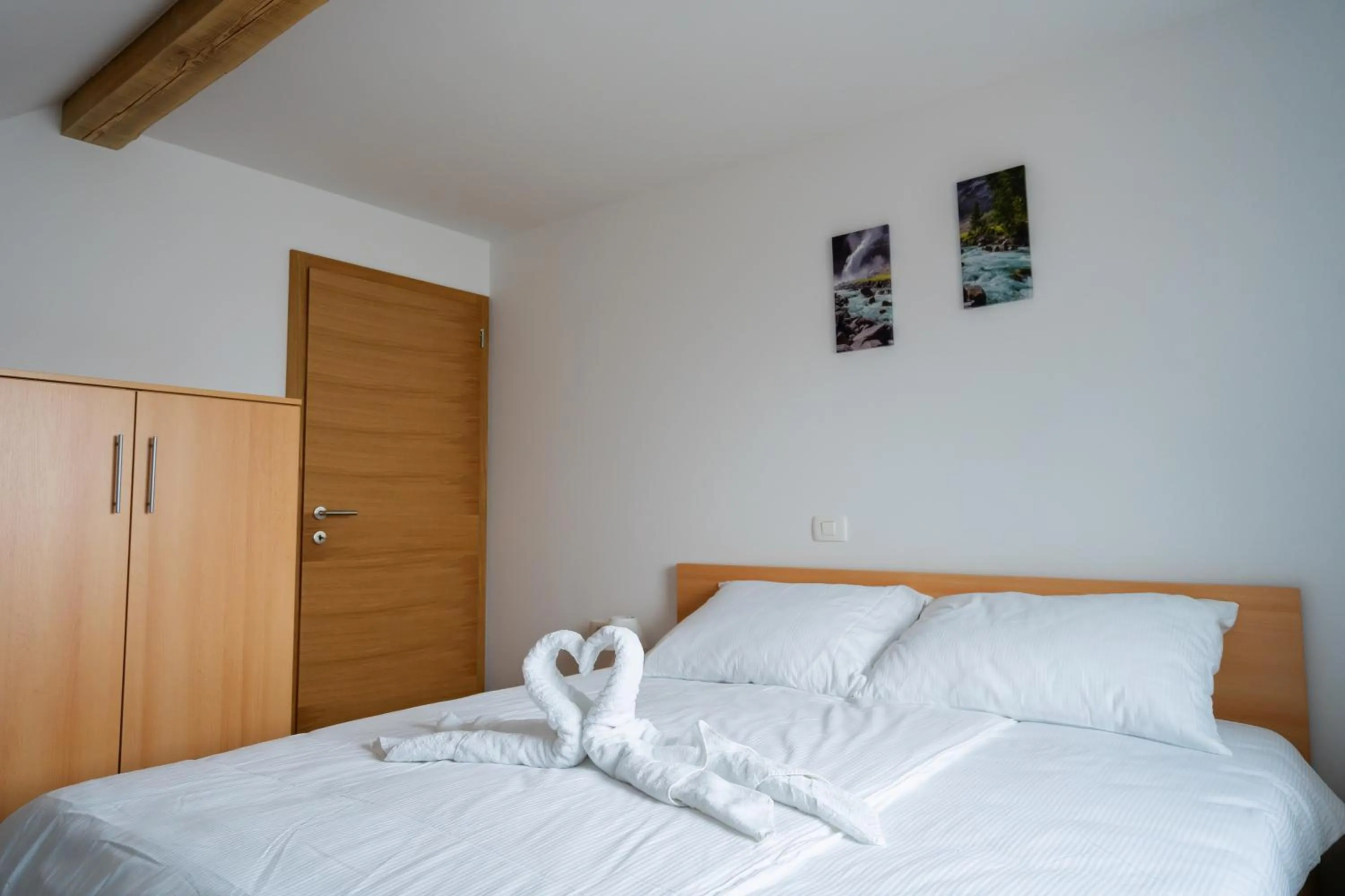 Bed in PJagodic Apartments & Wellness