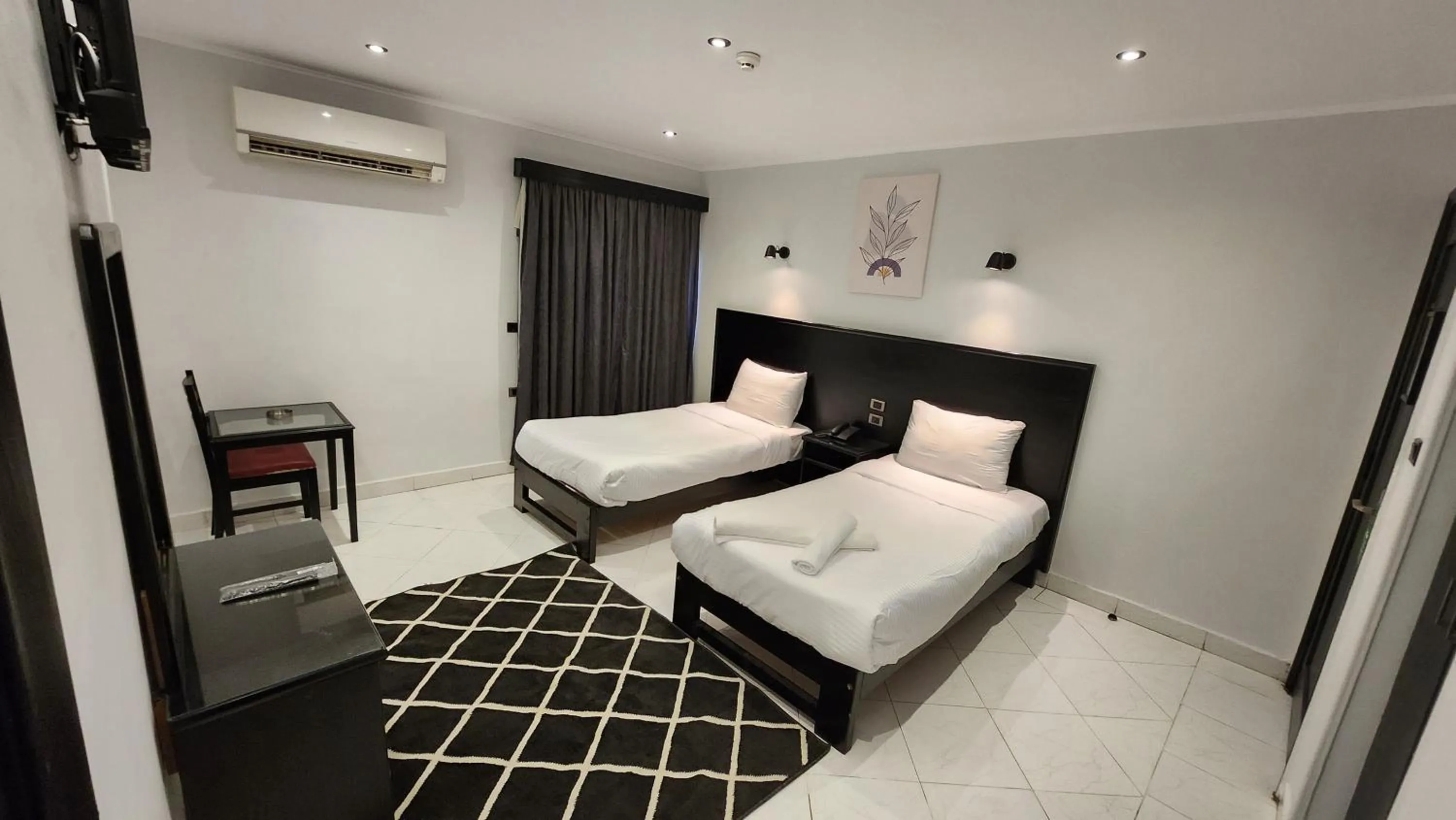 Bed in Helio Cairo Hotel