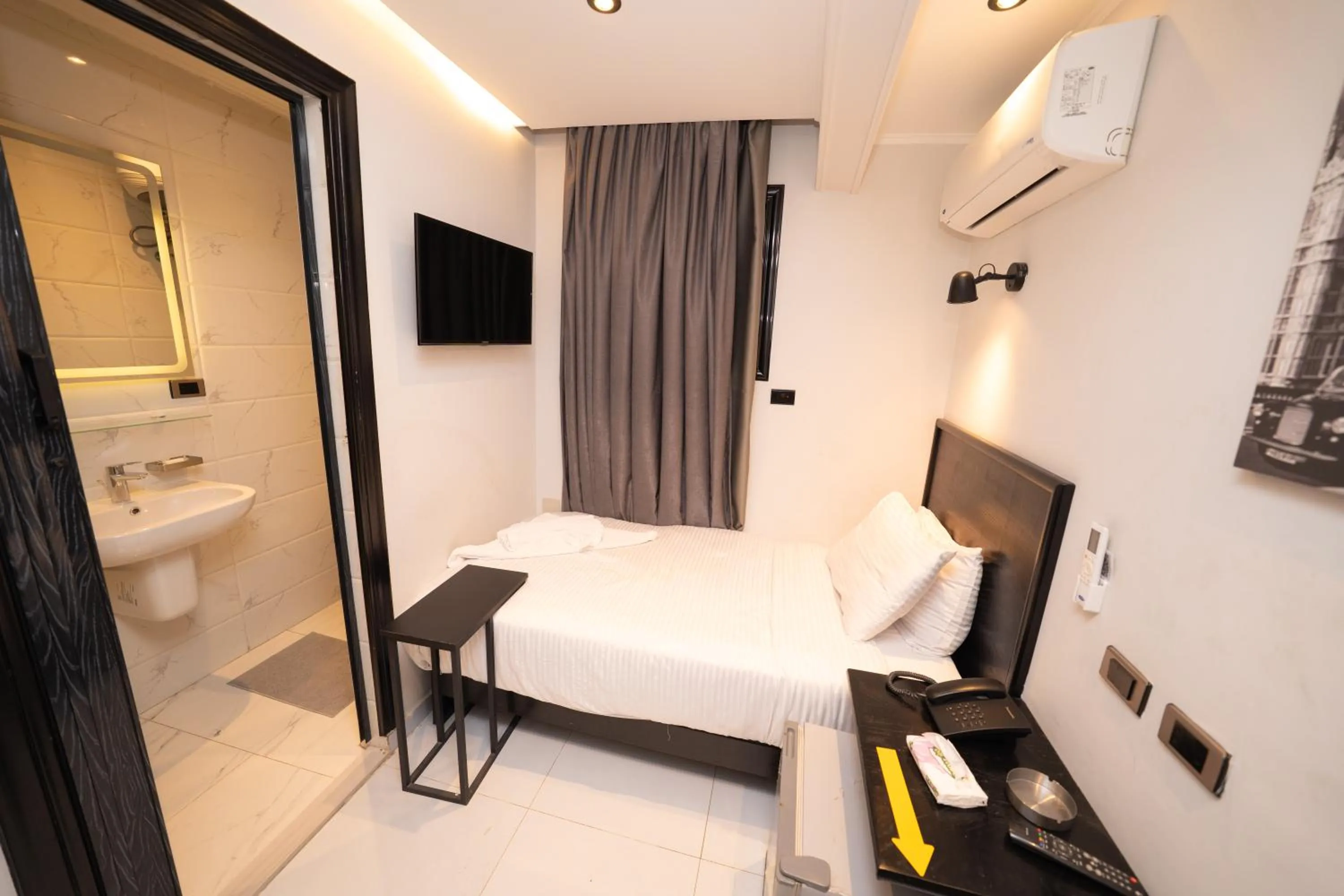 Bed in Helio Cairo Hotel