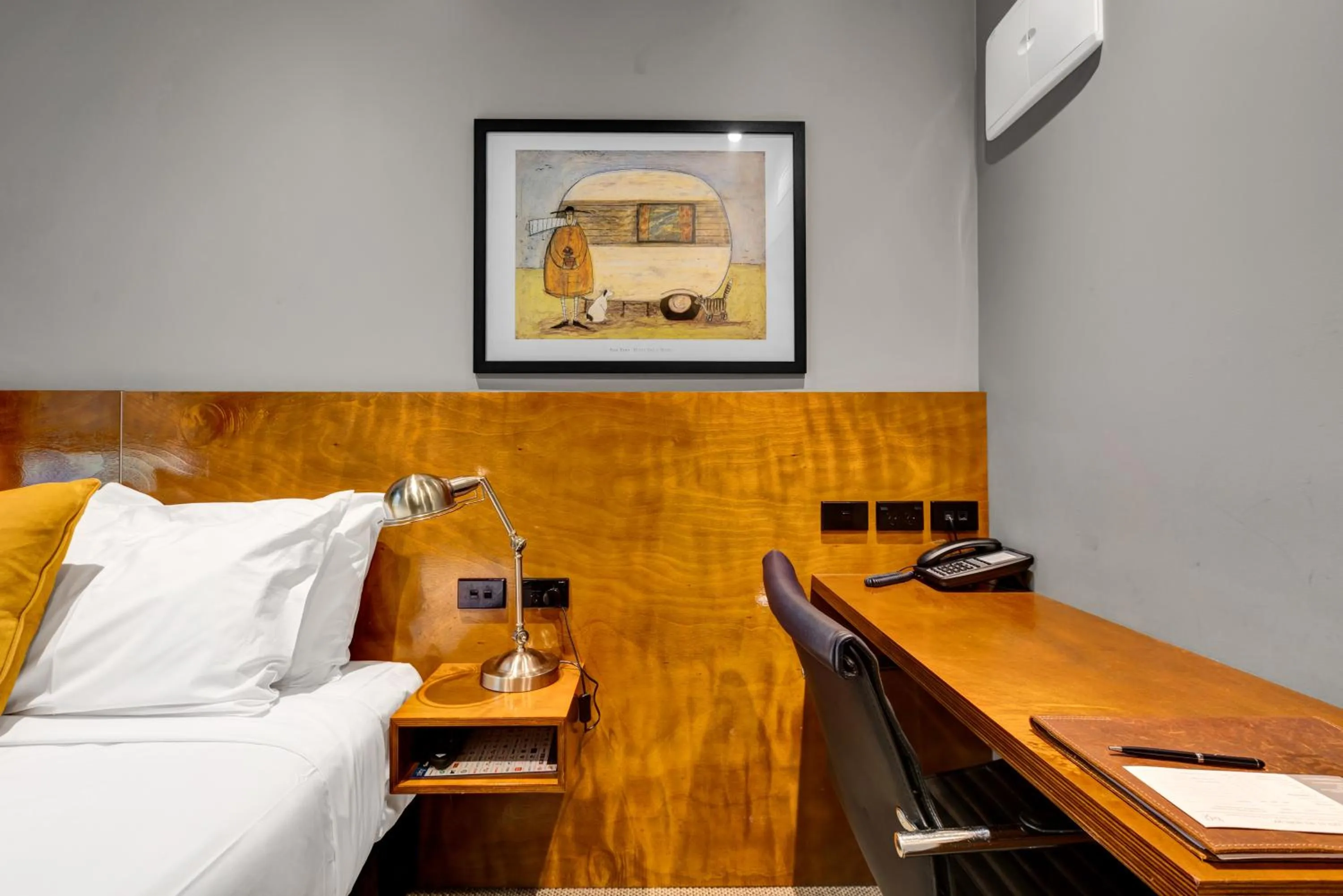 Bed in King and Queen Hotel Suites