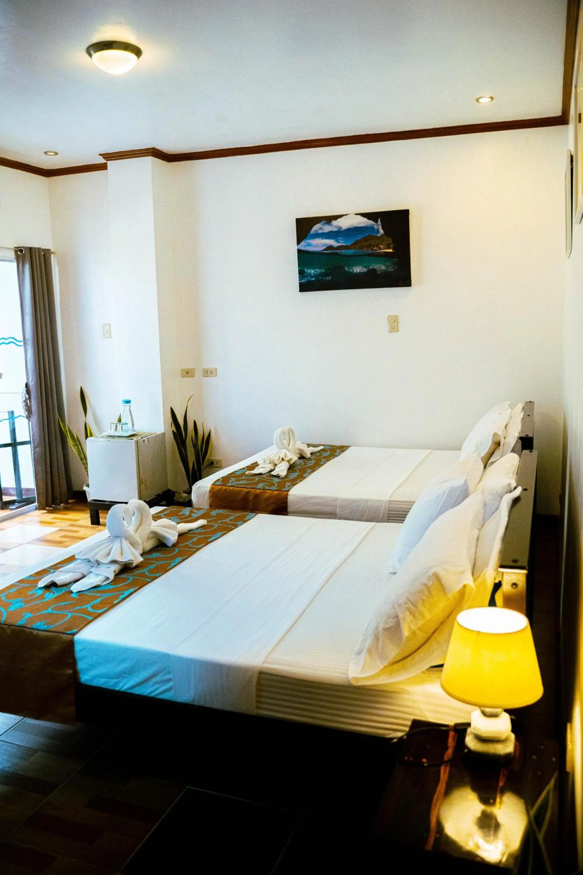 Bed in DiveGurus Boracay Beach Resort