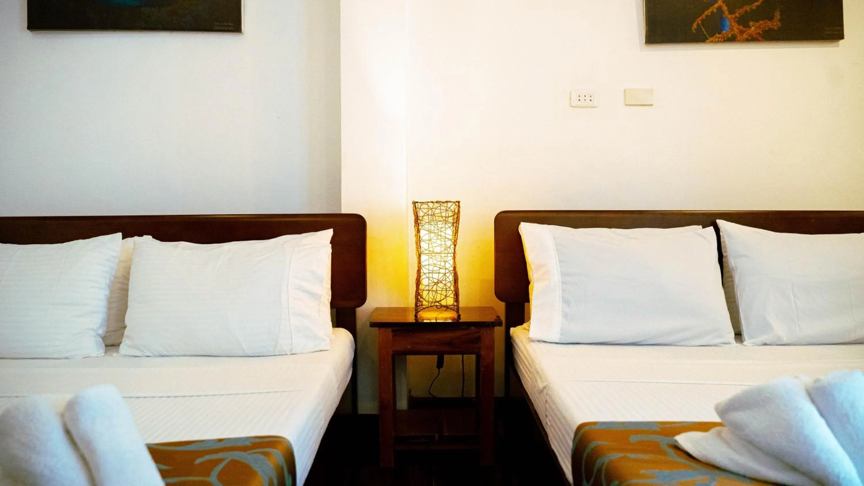 Bed in DiveGurus Boracay Beach Resort