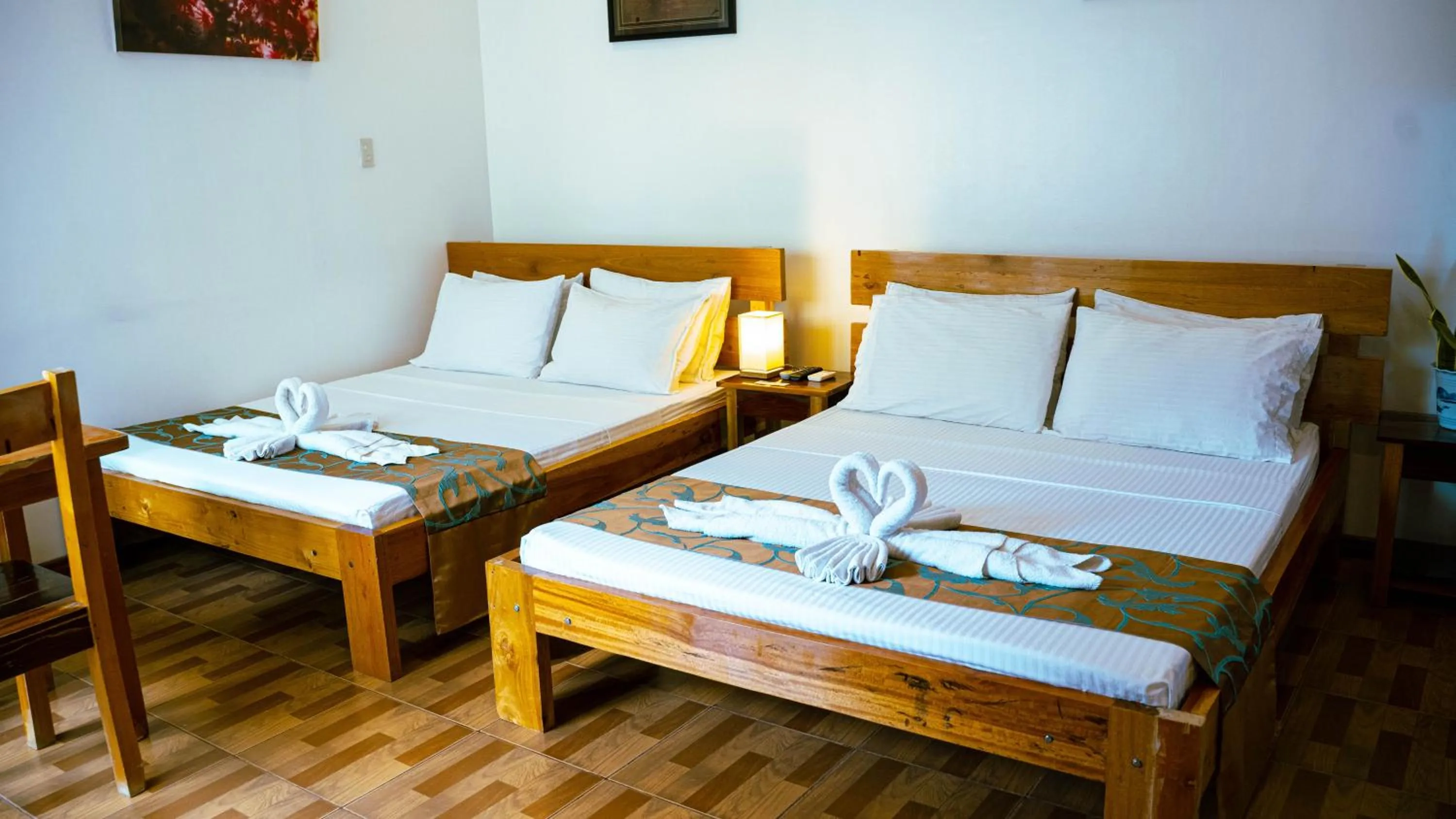 Bed in DiveGurus Boracay Beach Resort