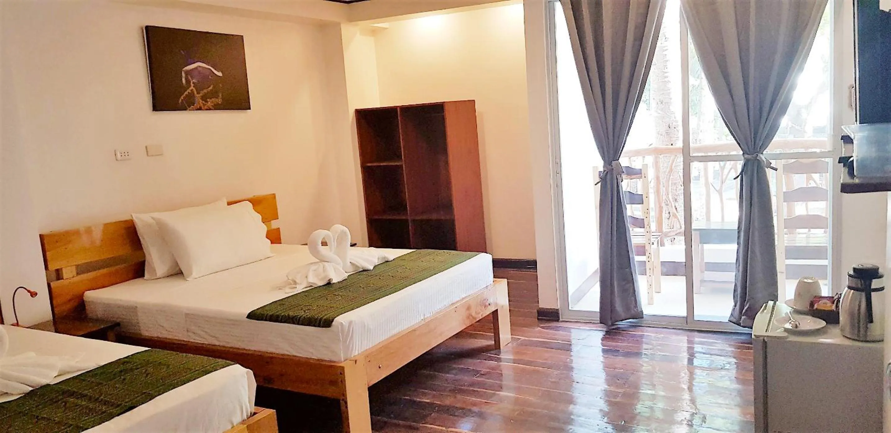 Bed in DiveGurus Boracay Beach Resort