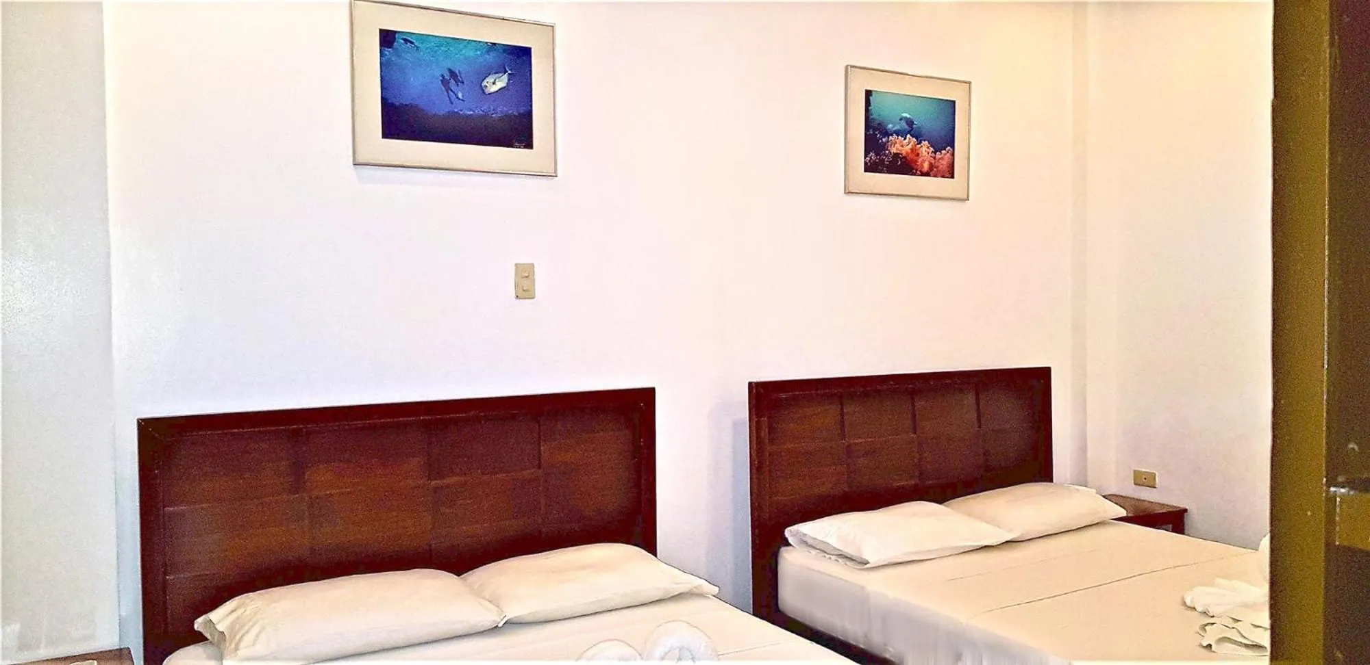 Bed in DiveGurus Boracay Beach Resort