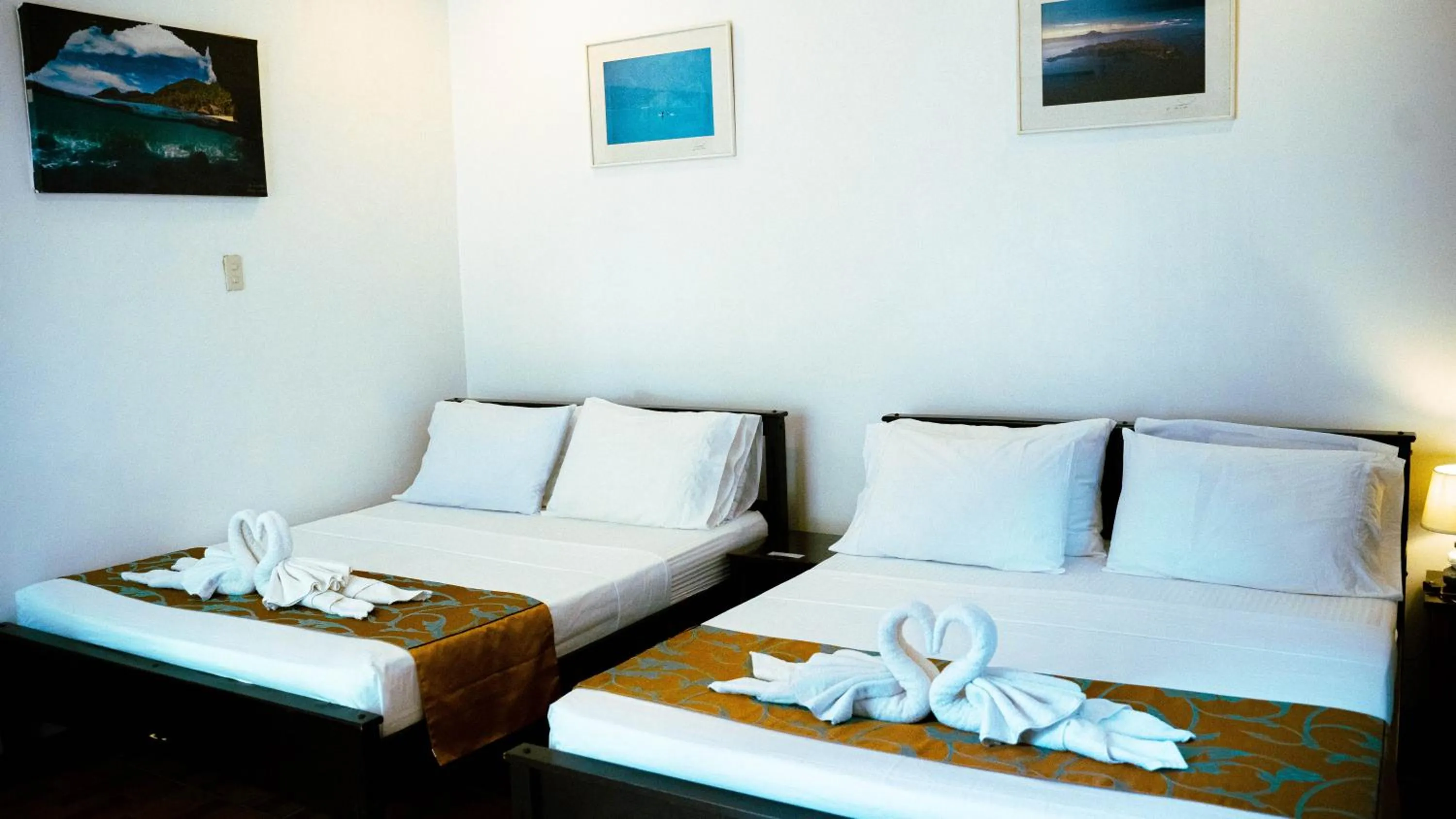 Bed in DiveGurus Boracay Beach Resort