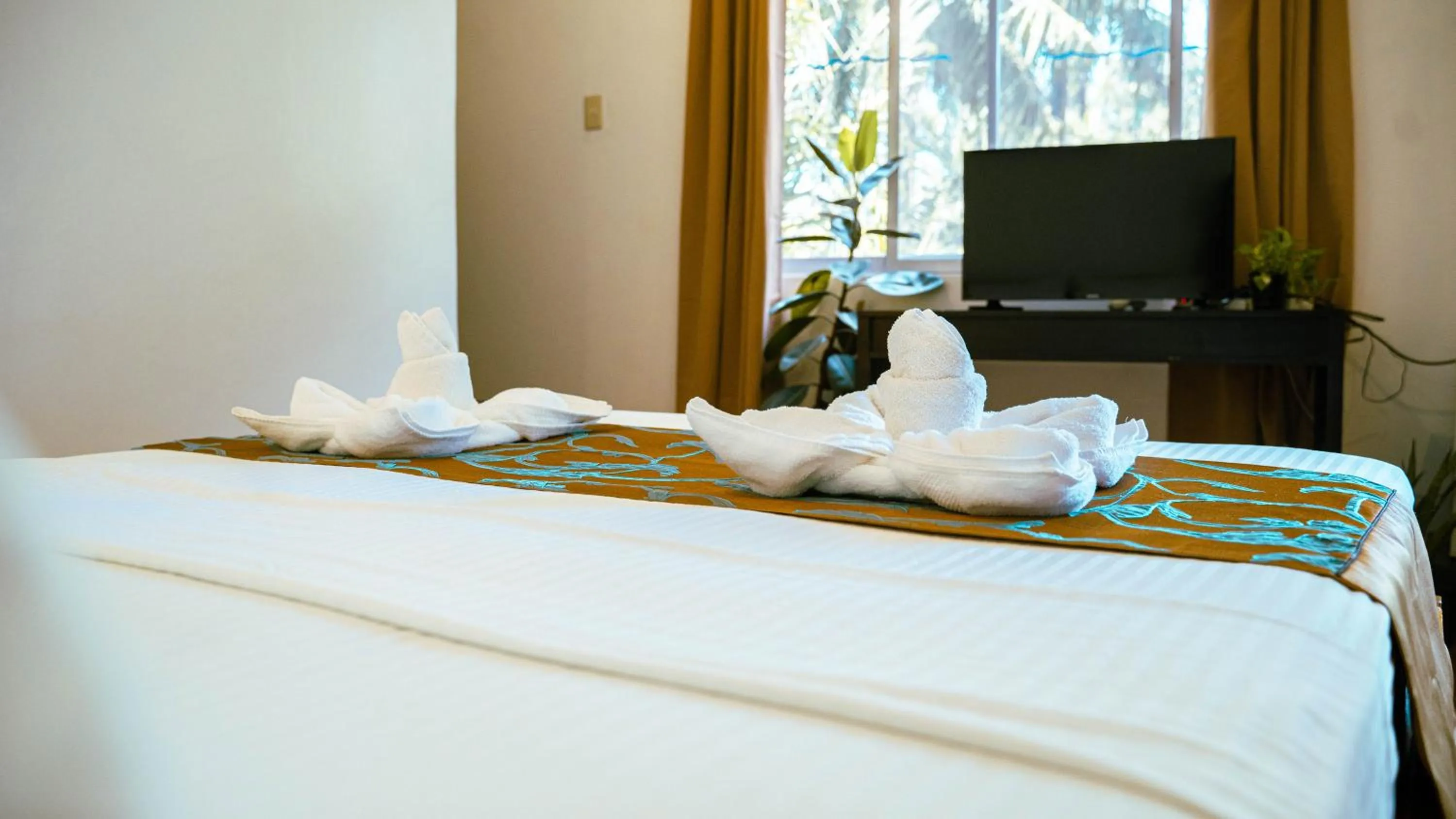 Bed in DiveGurus Boracay Beach Resort