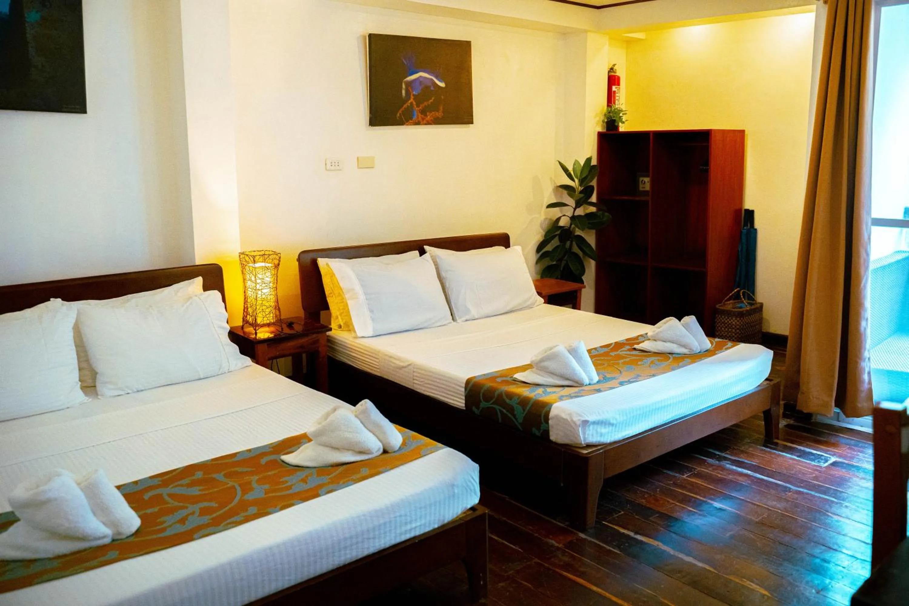 Bed in DiveGurus Boracay Beach Resort