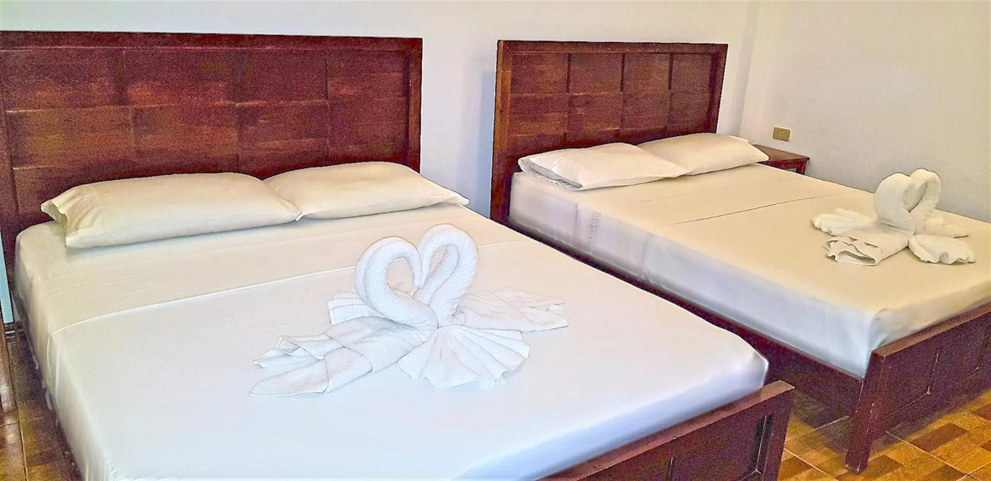Bed in DiveGurus Boracay Beach Resort