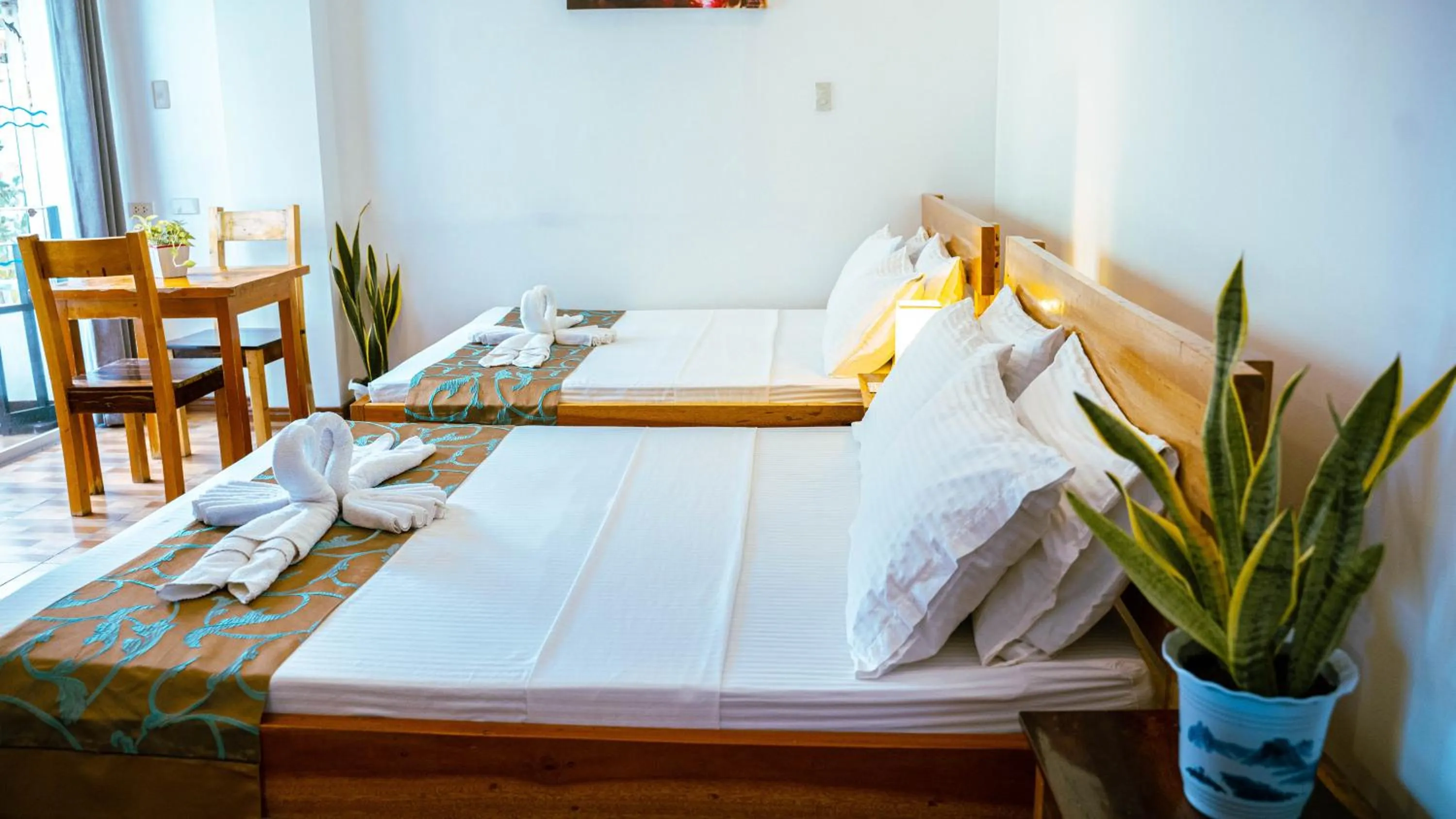 Bed in DiveGurus Boracay Beach Resort