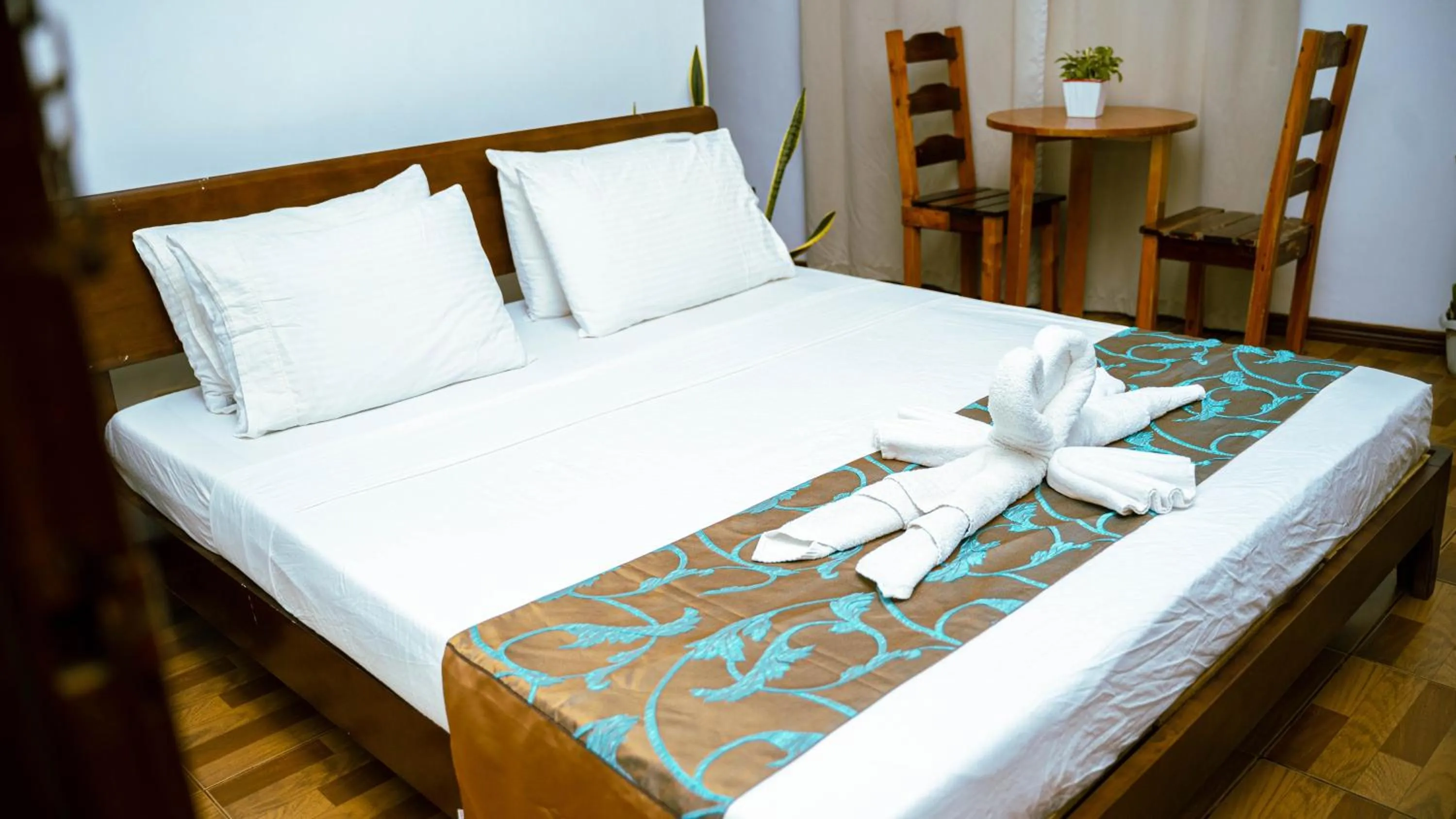 Bed in DiveGurus Boracay Beach Resort