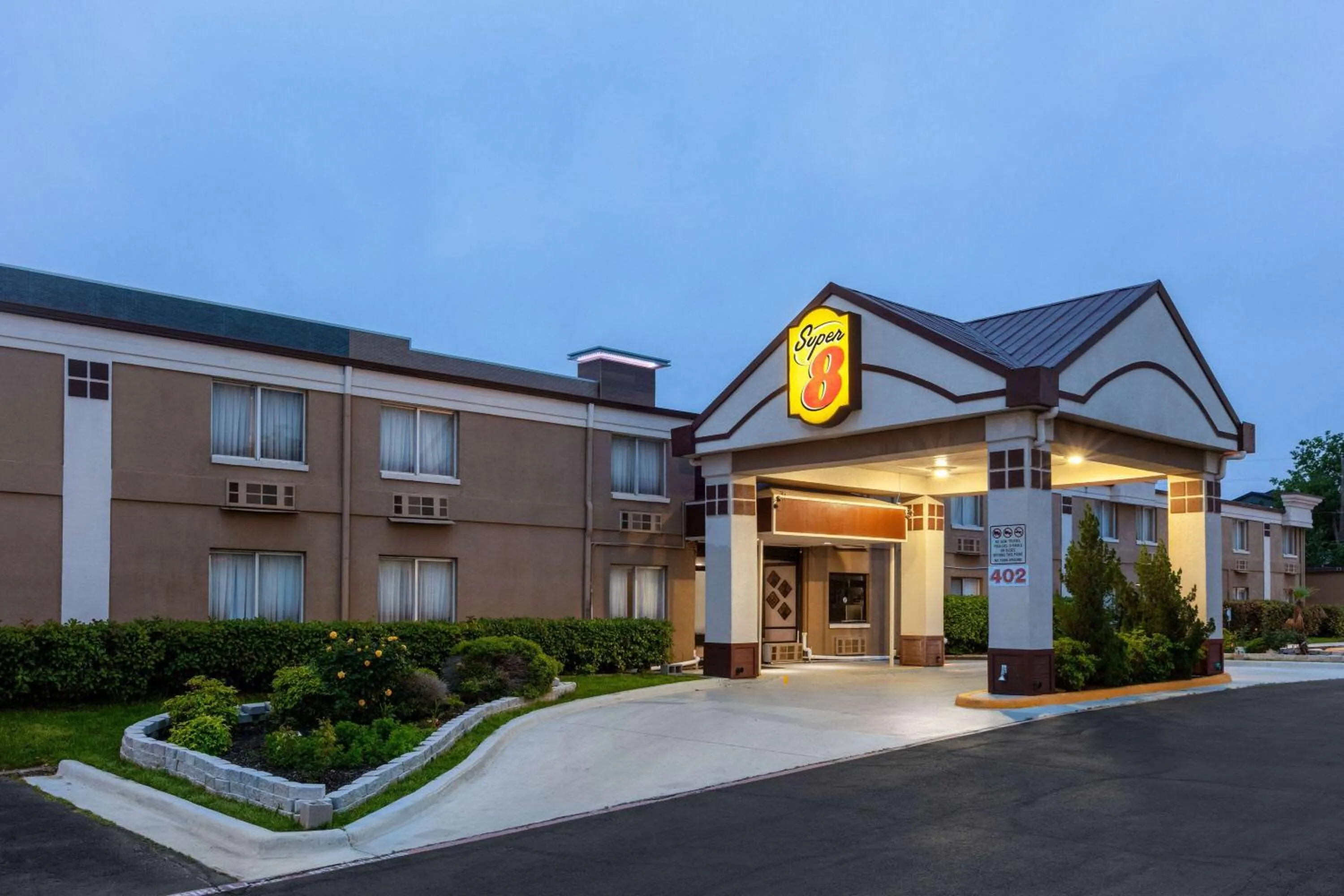 Property building in Super 8 by Wyndham Grand Prairie North