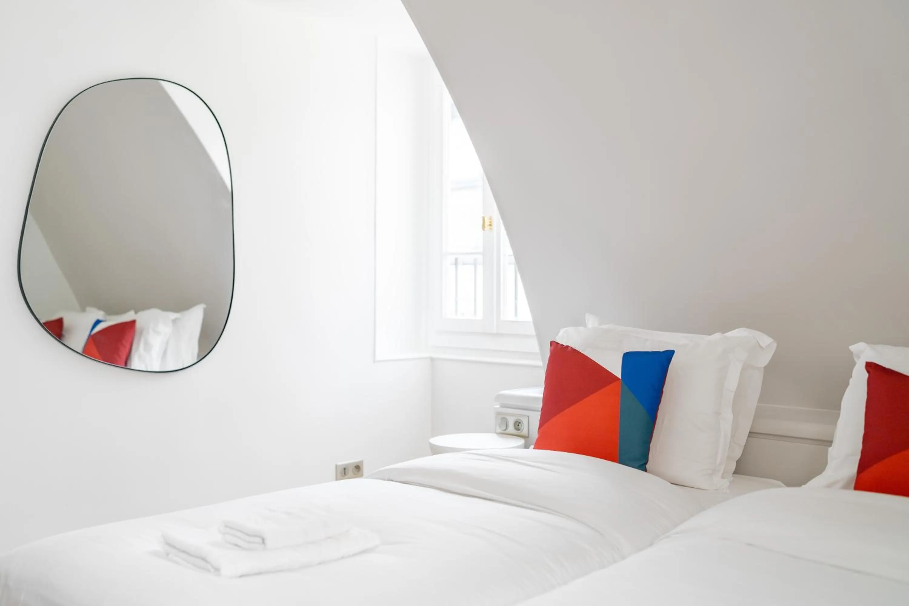 Bed in HotelHome Paris 16