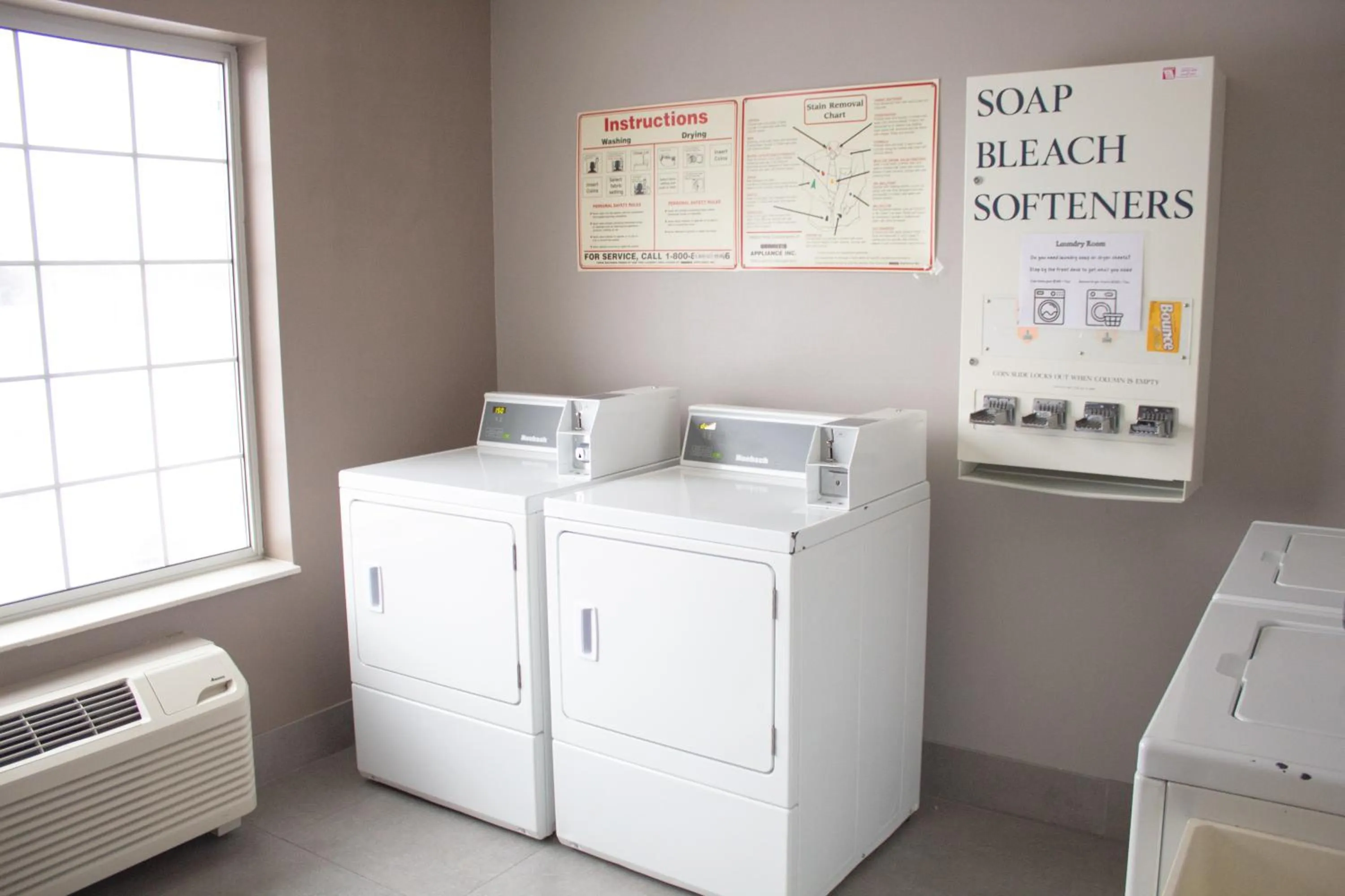 washing machine in Country Inn & Suites by Radisson, Big Rapids, MI
