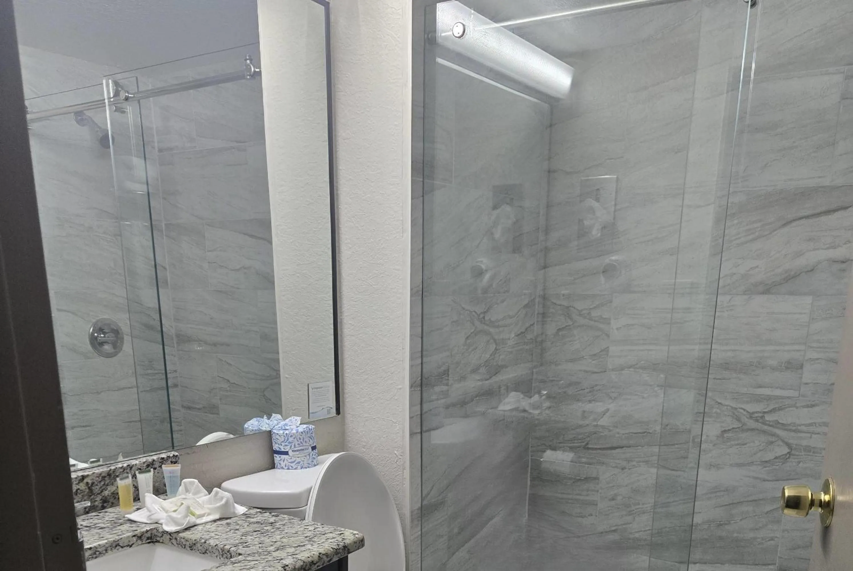 Bathroom in Days Inn & Suites by Wyndham Tampa/Raymond James Stadium