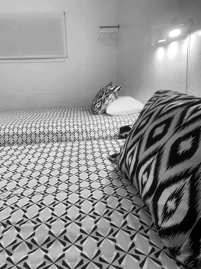 Bed in Dragonfly Motor Lodge