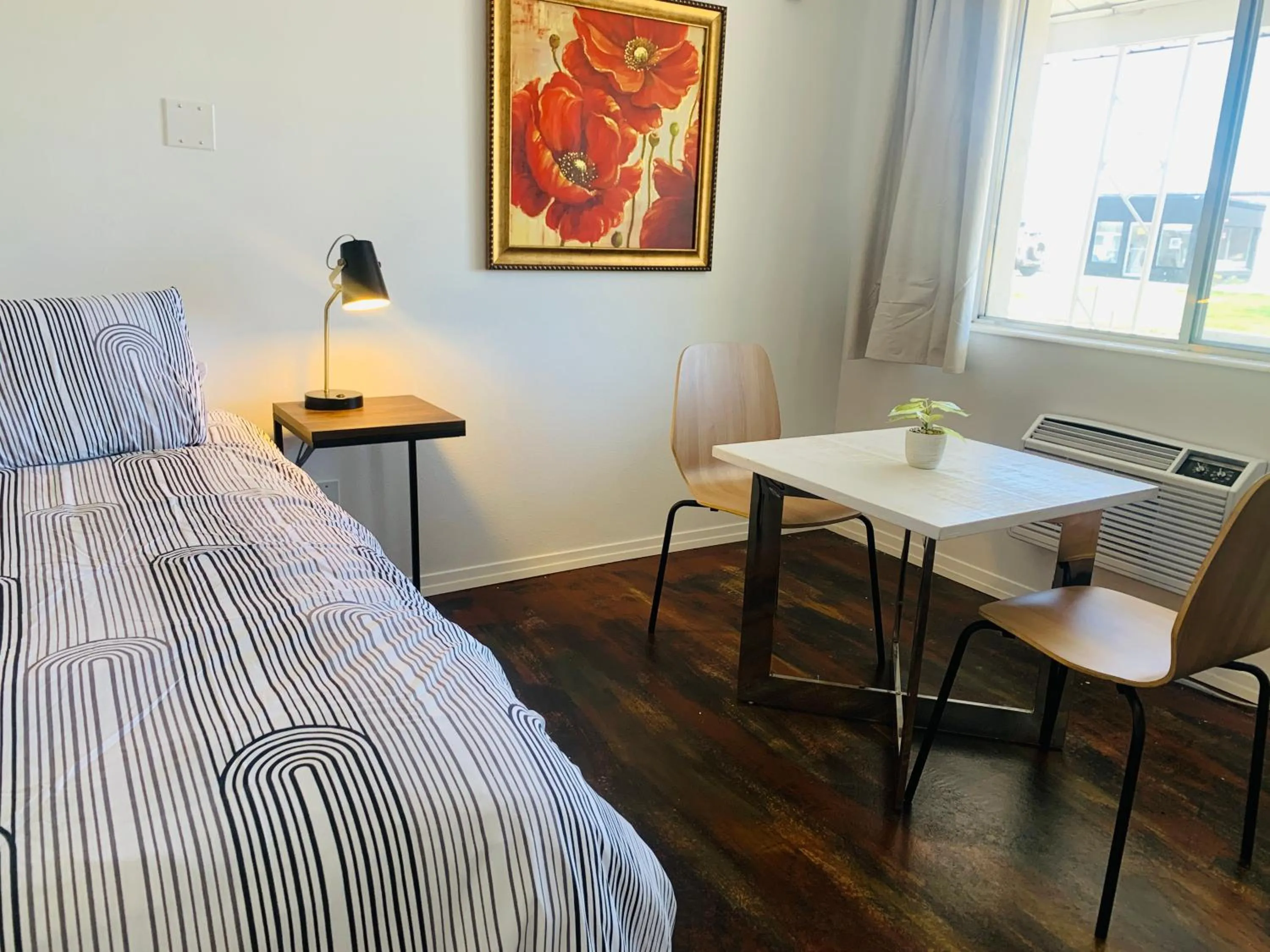 Bed in Dragonfly Motor Lodge