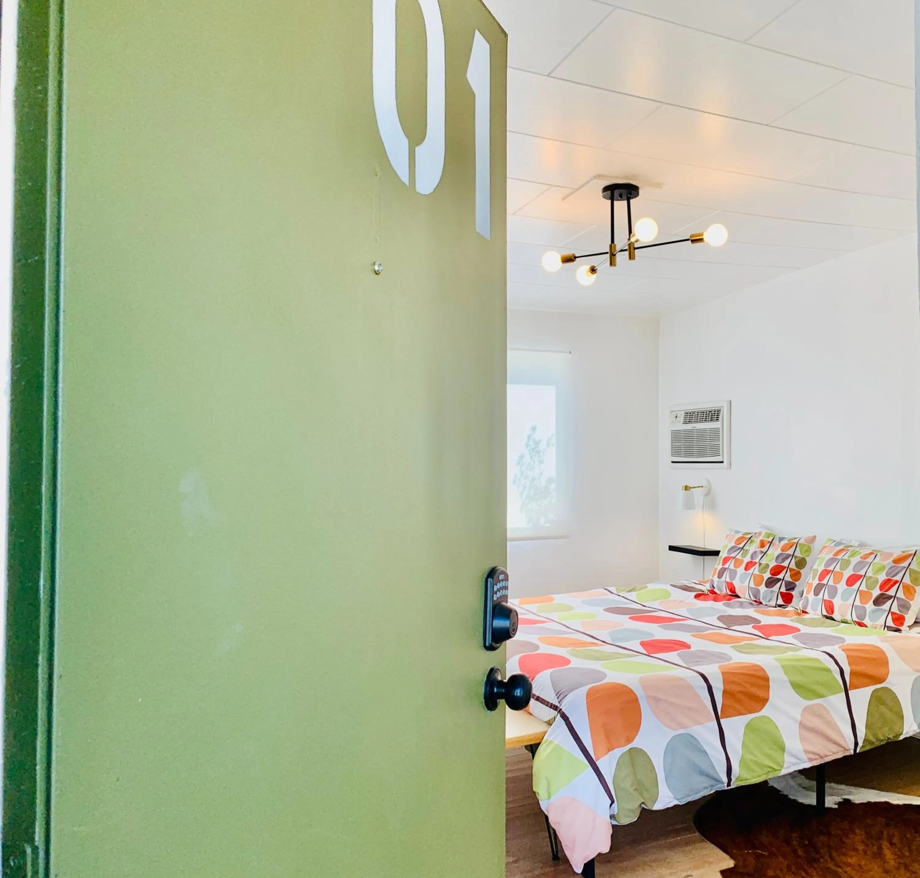 Bed in Dragonfly Motor Lodge