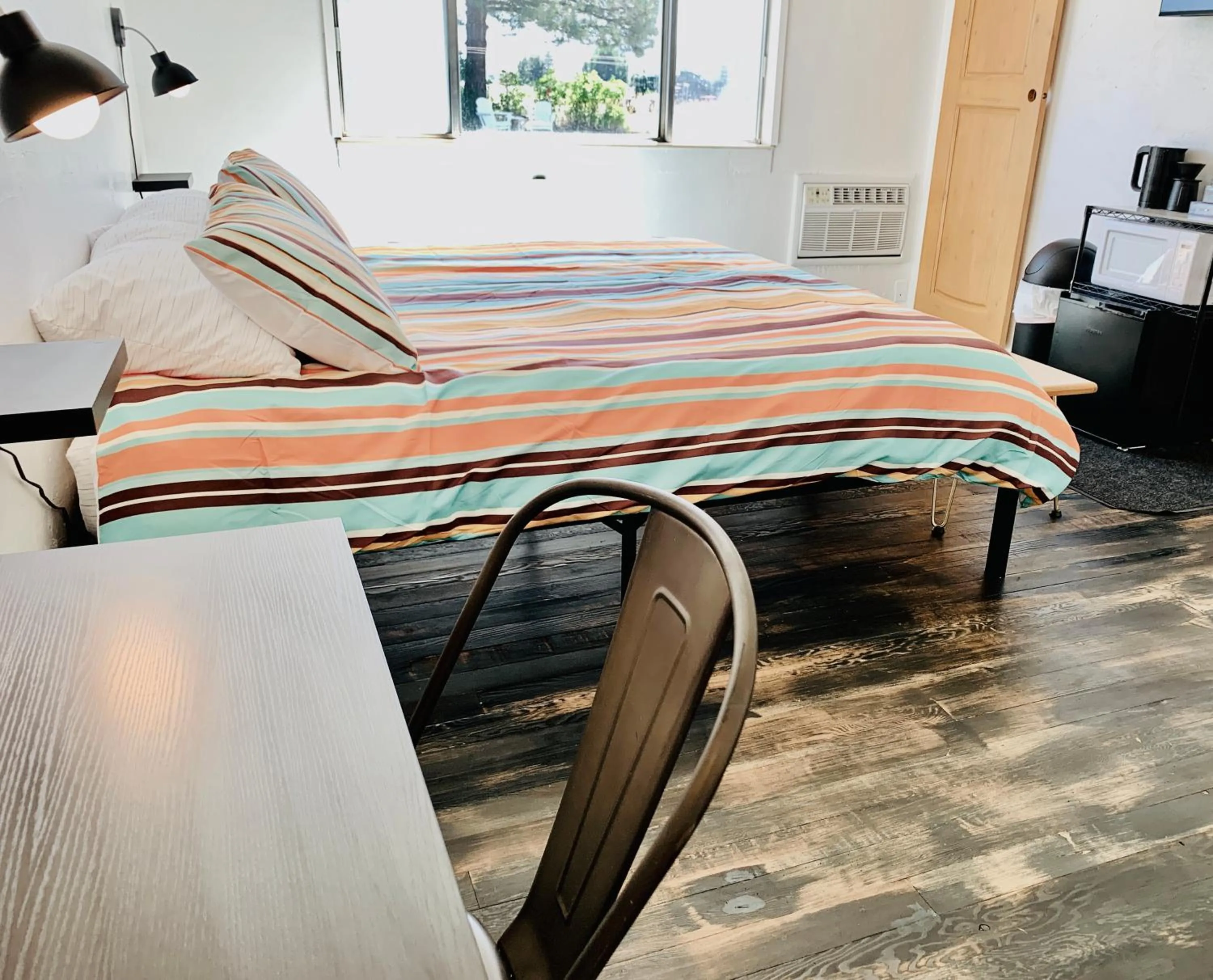 Bed in Dragonfly Motor Lodge