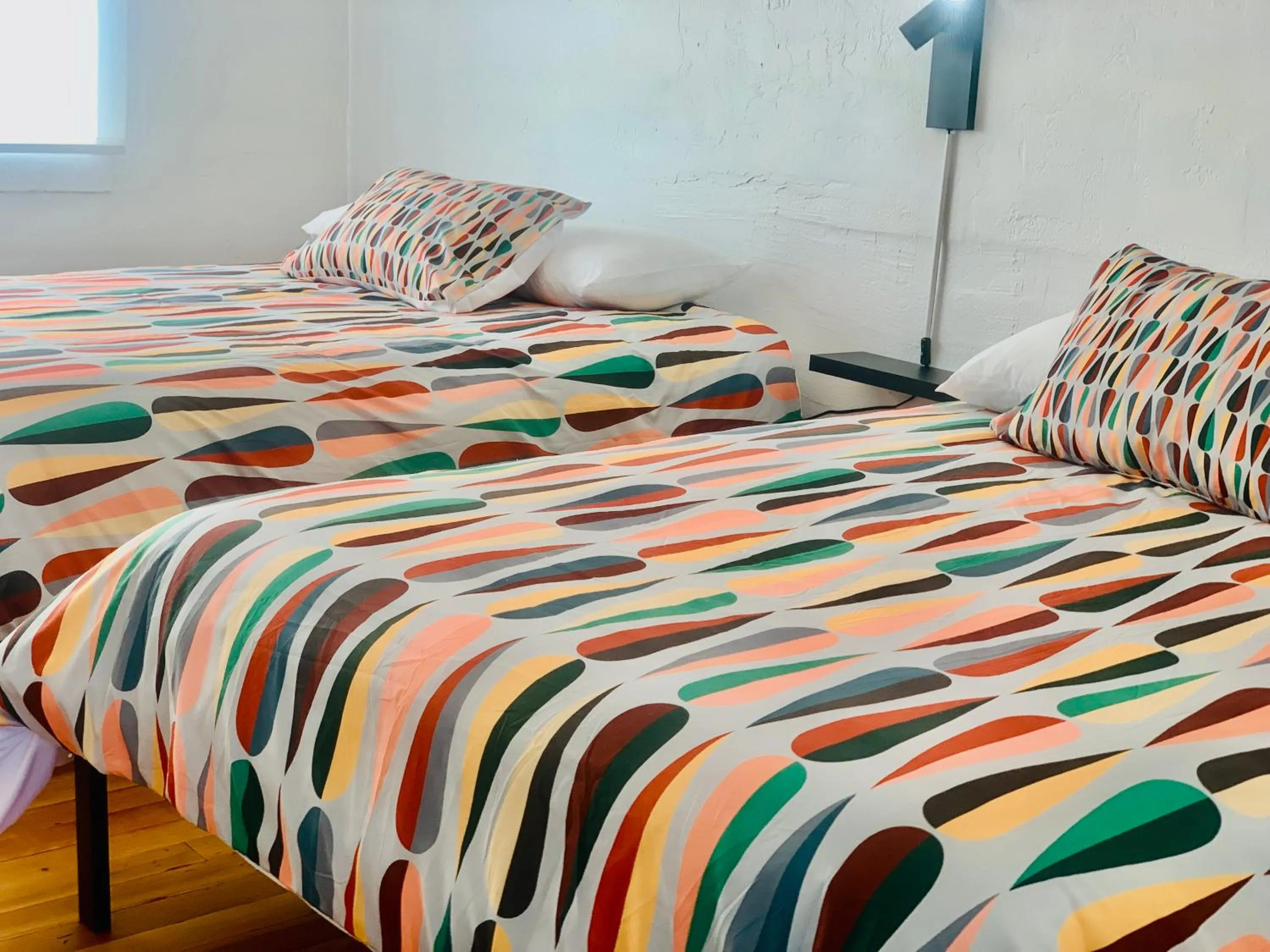 Bed in Dragonfly Motor Lodge