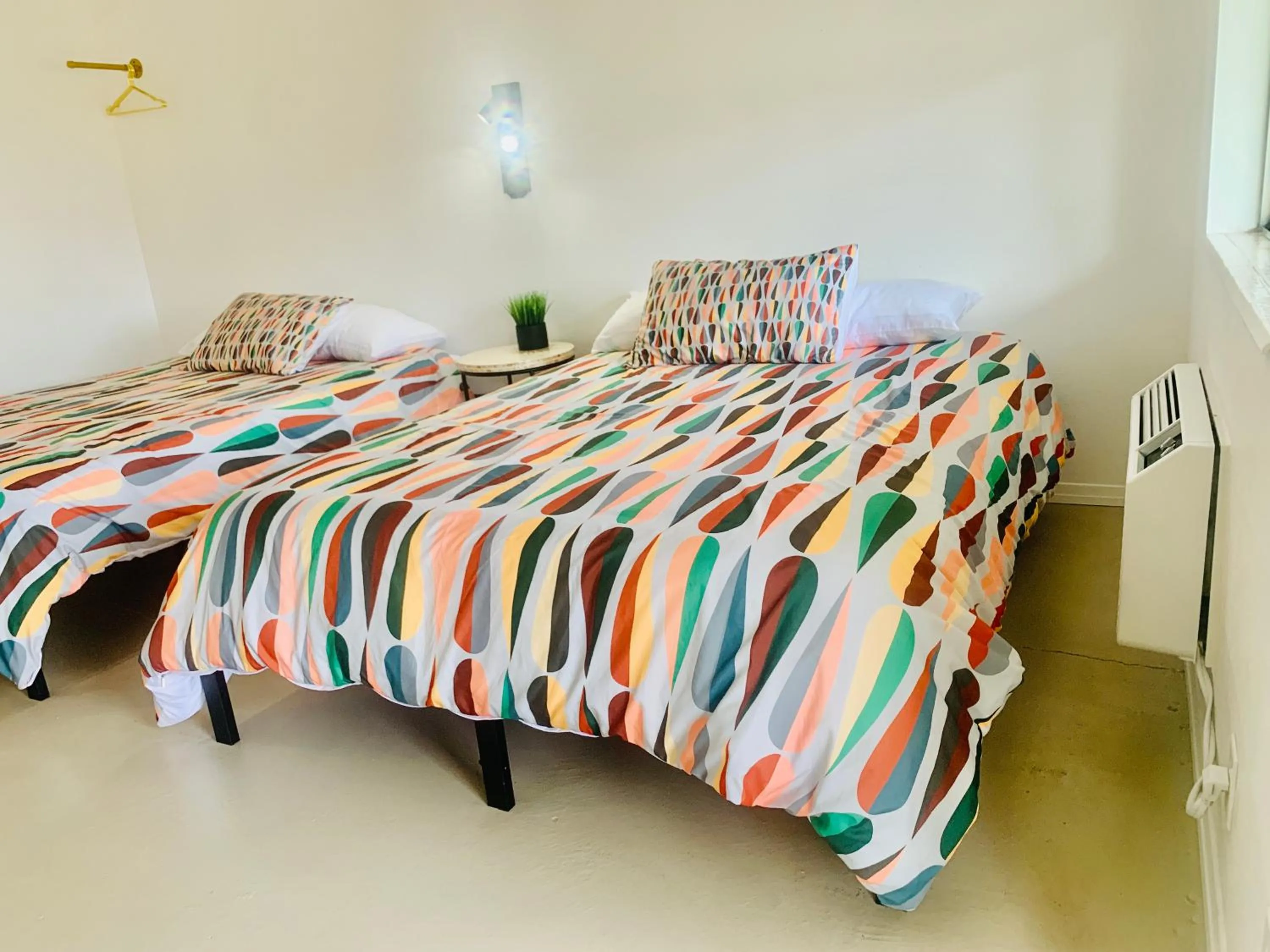 Bed in Dragonfly Motor Lodge