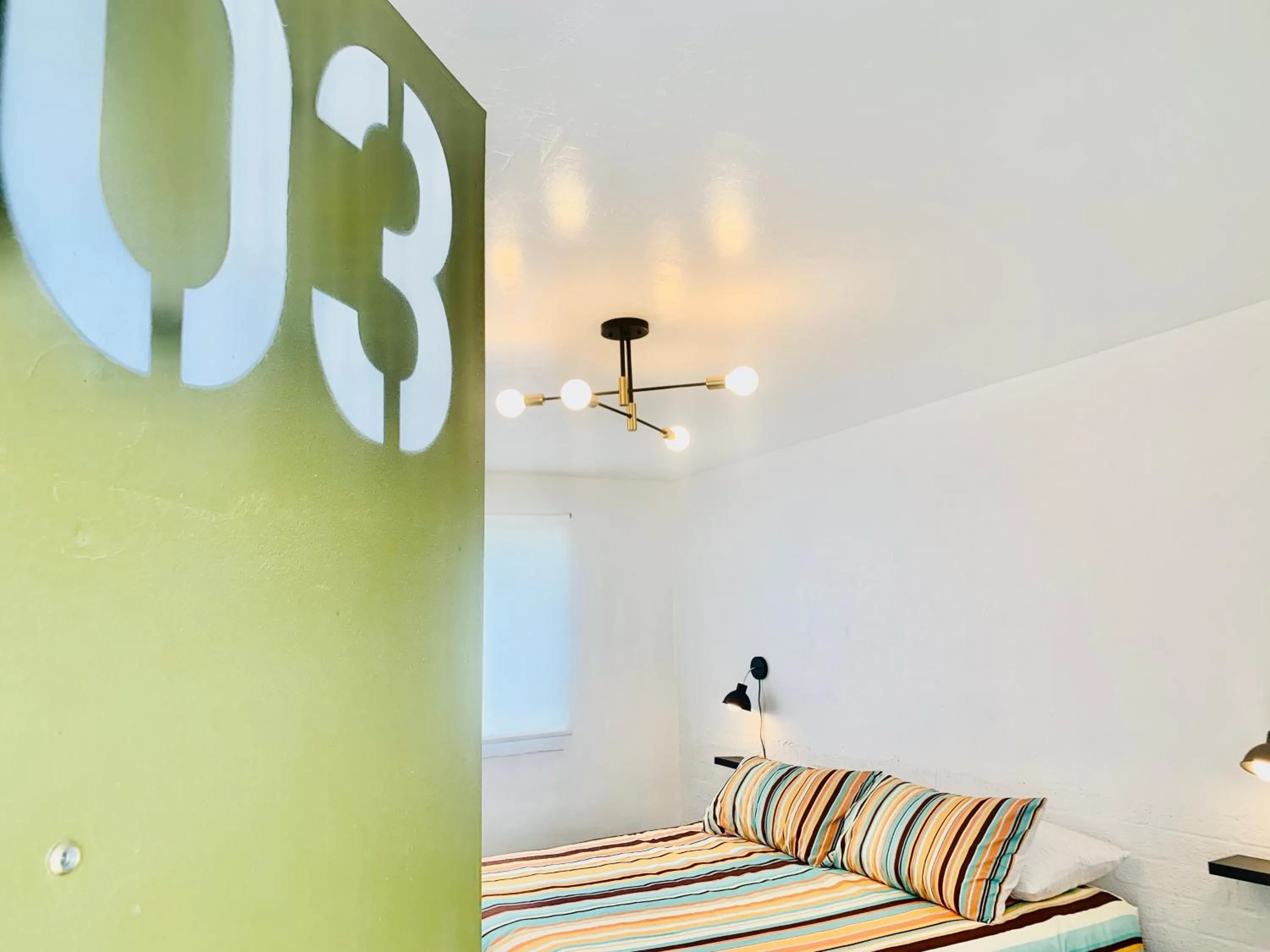 Bed in Dragonfly Motor Lodge