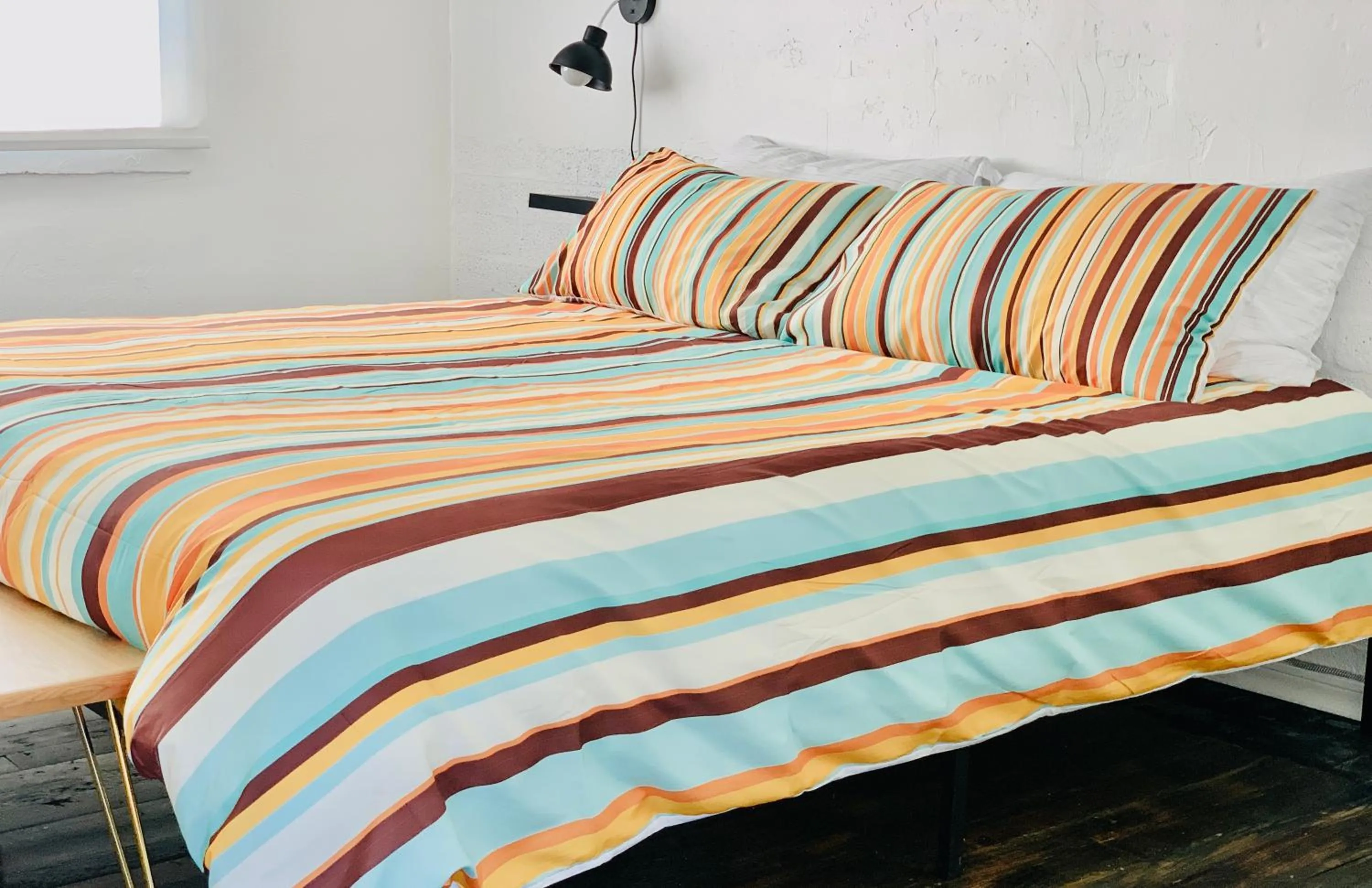 Bed in Dragonfly Motor Lodge