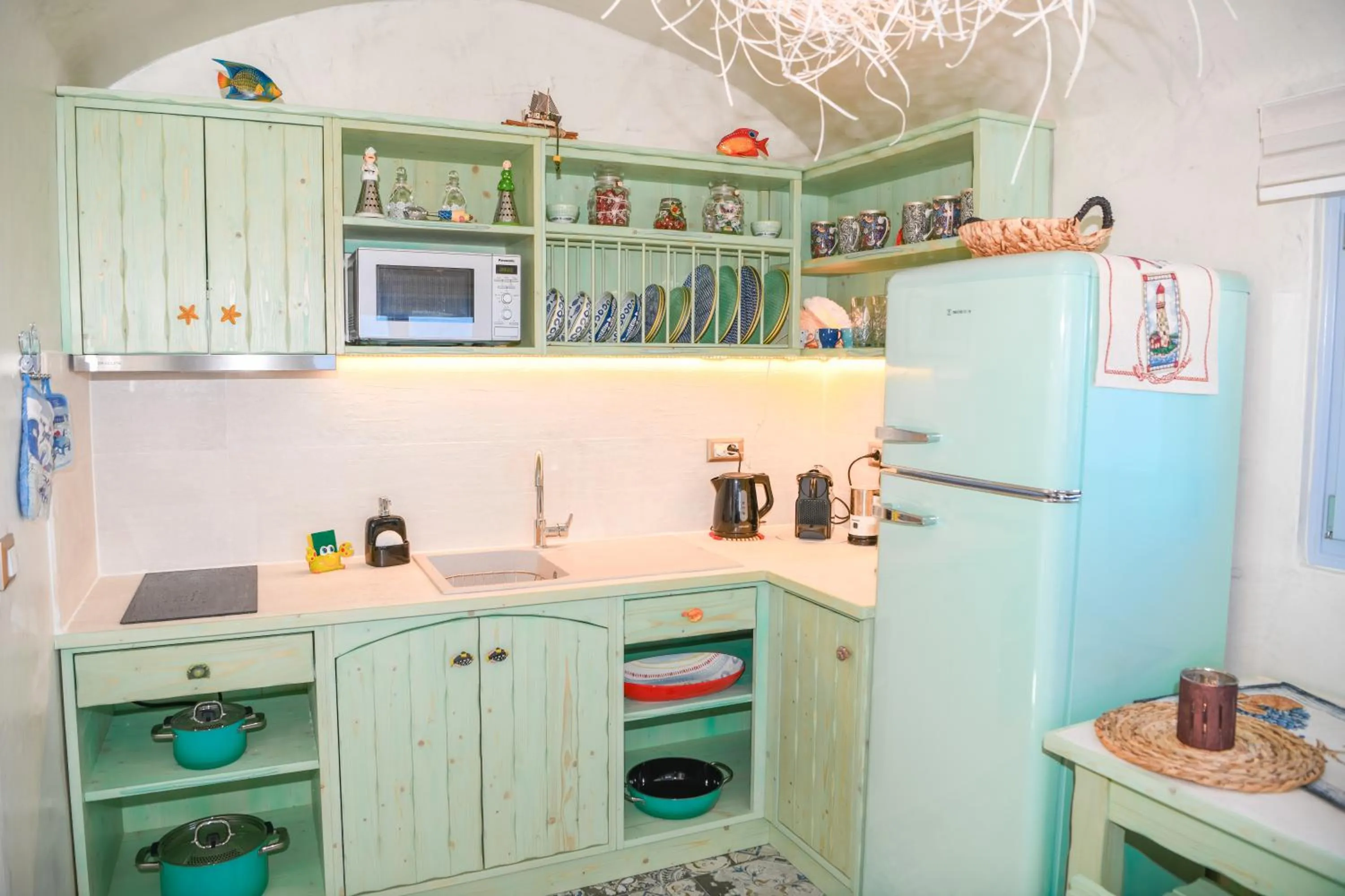 Kitchen or kitchenette in Starlight Luxury Seaside Villa & Suites