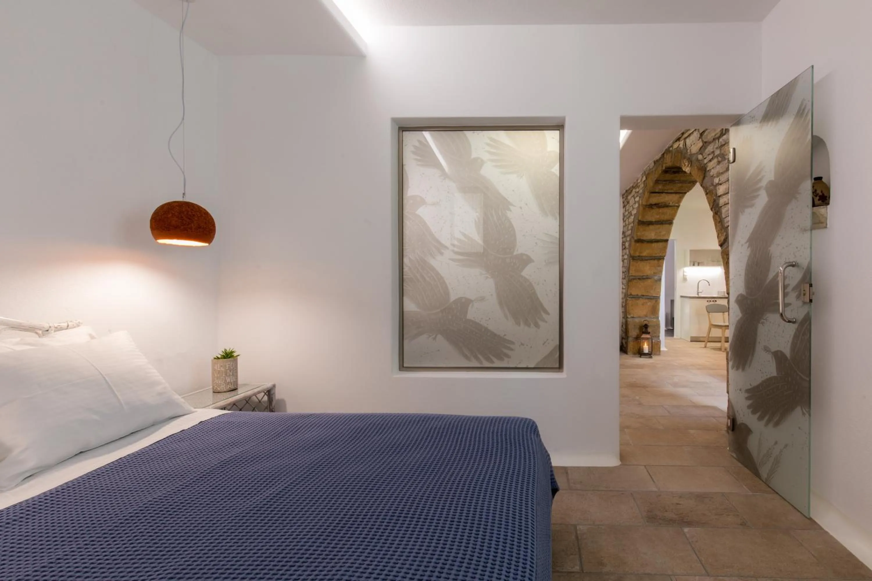 Bed in Arco Naxos Luxury Apartments