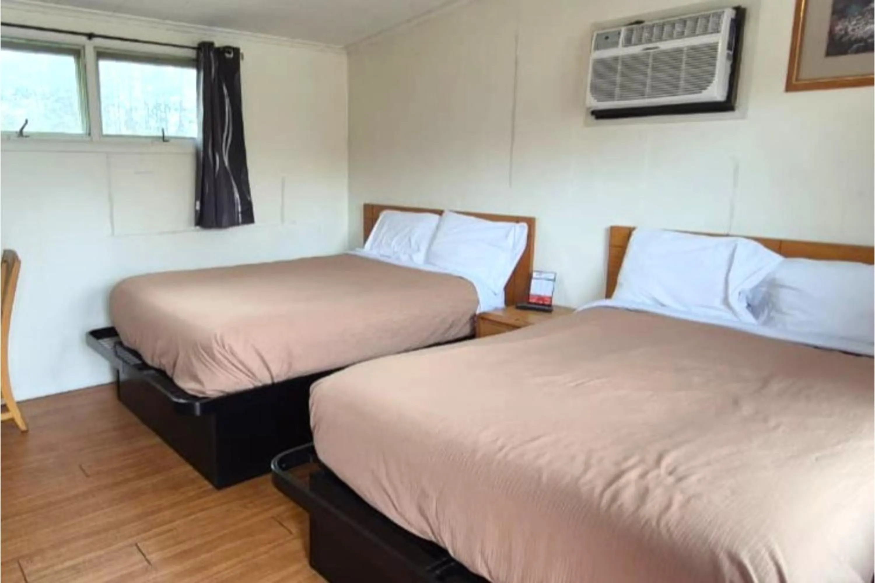 Bedroom, Bed in Economy Inn Cadillac MI by Hotel O