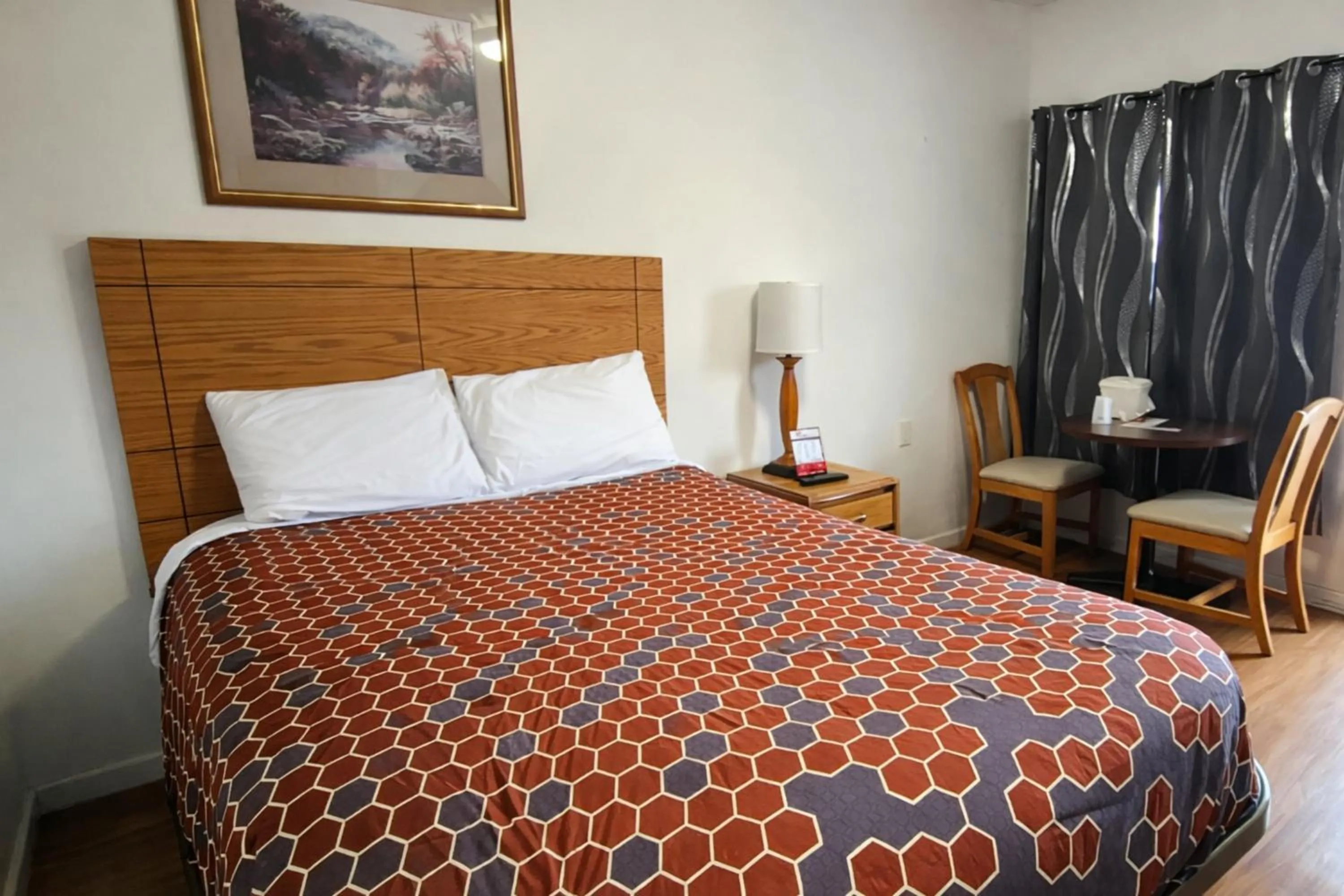 Bedroom, Bed in Economy Inn Cadillac MI by Hotel O