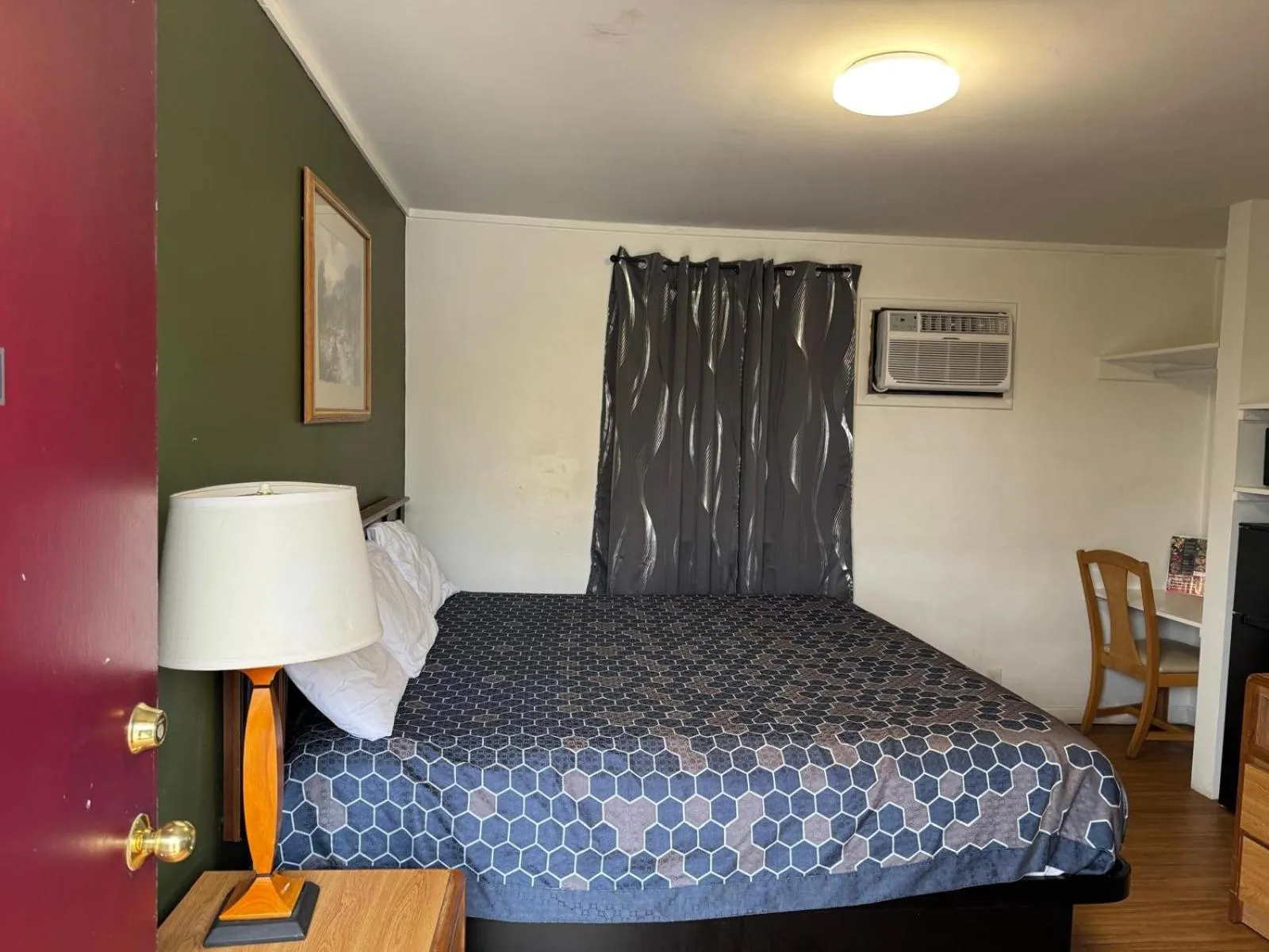 Bedroom, Bed in Economy Inn Cadillac MI by Hotel O