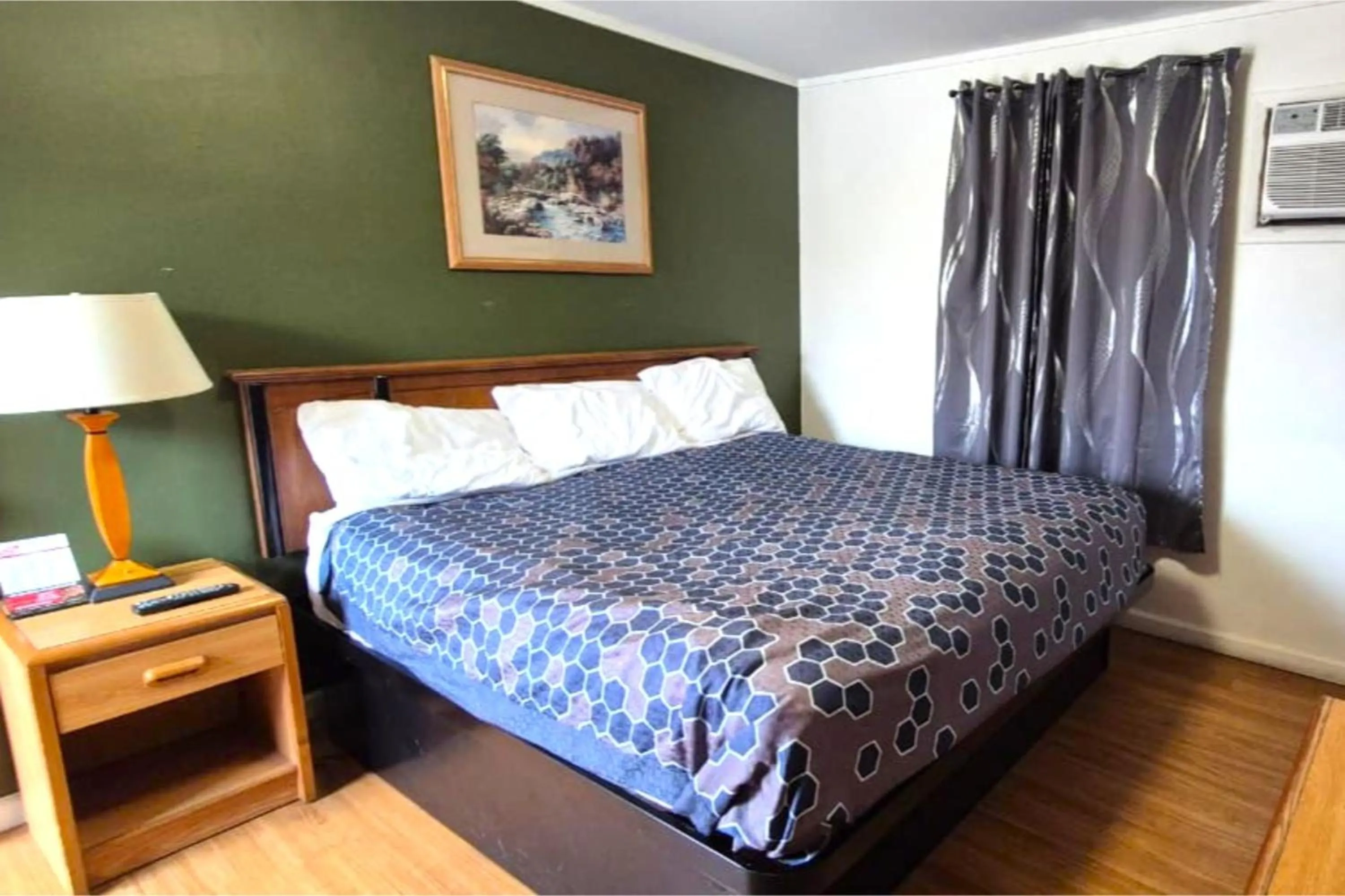 Bedroom, Bed in Economy Inn Cadillac MI by Hotel O