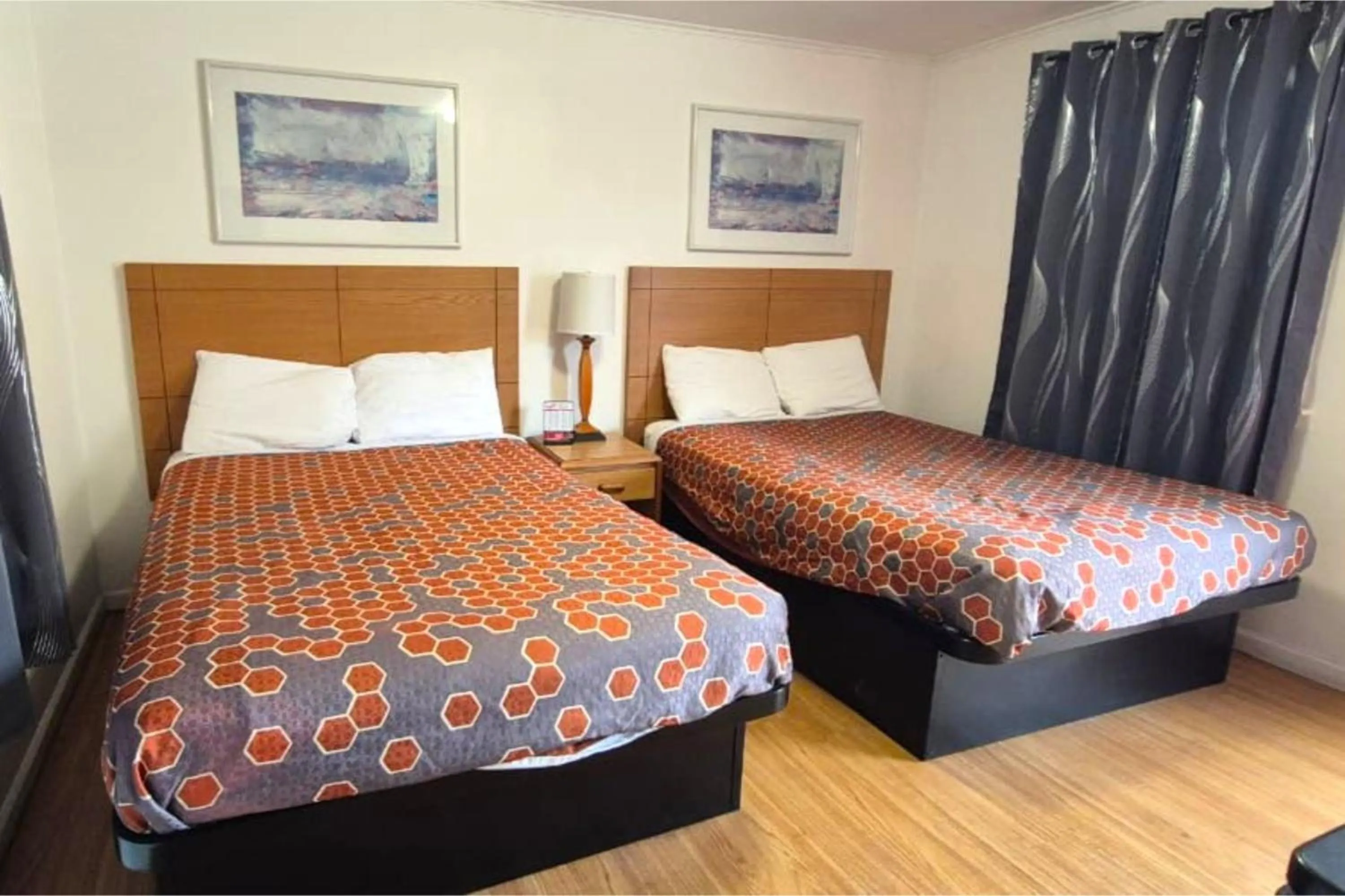 Bedroom, Bed in Economy Inn Cadillac MI by Hotel O