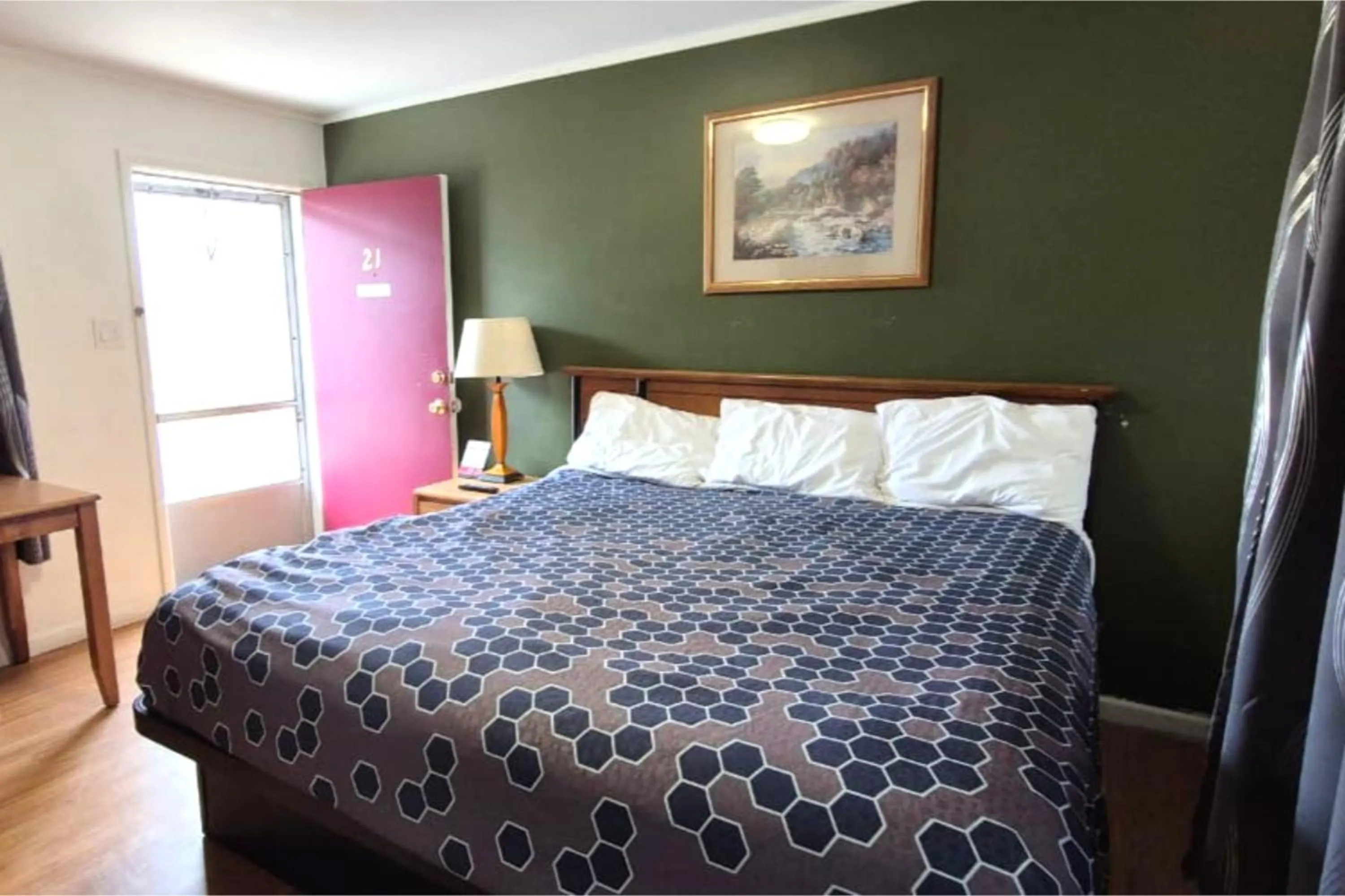 Bedroom, Bed in Economy Inn Cadillac MI by Hotel O