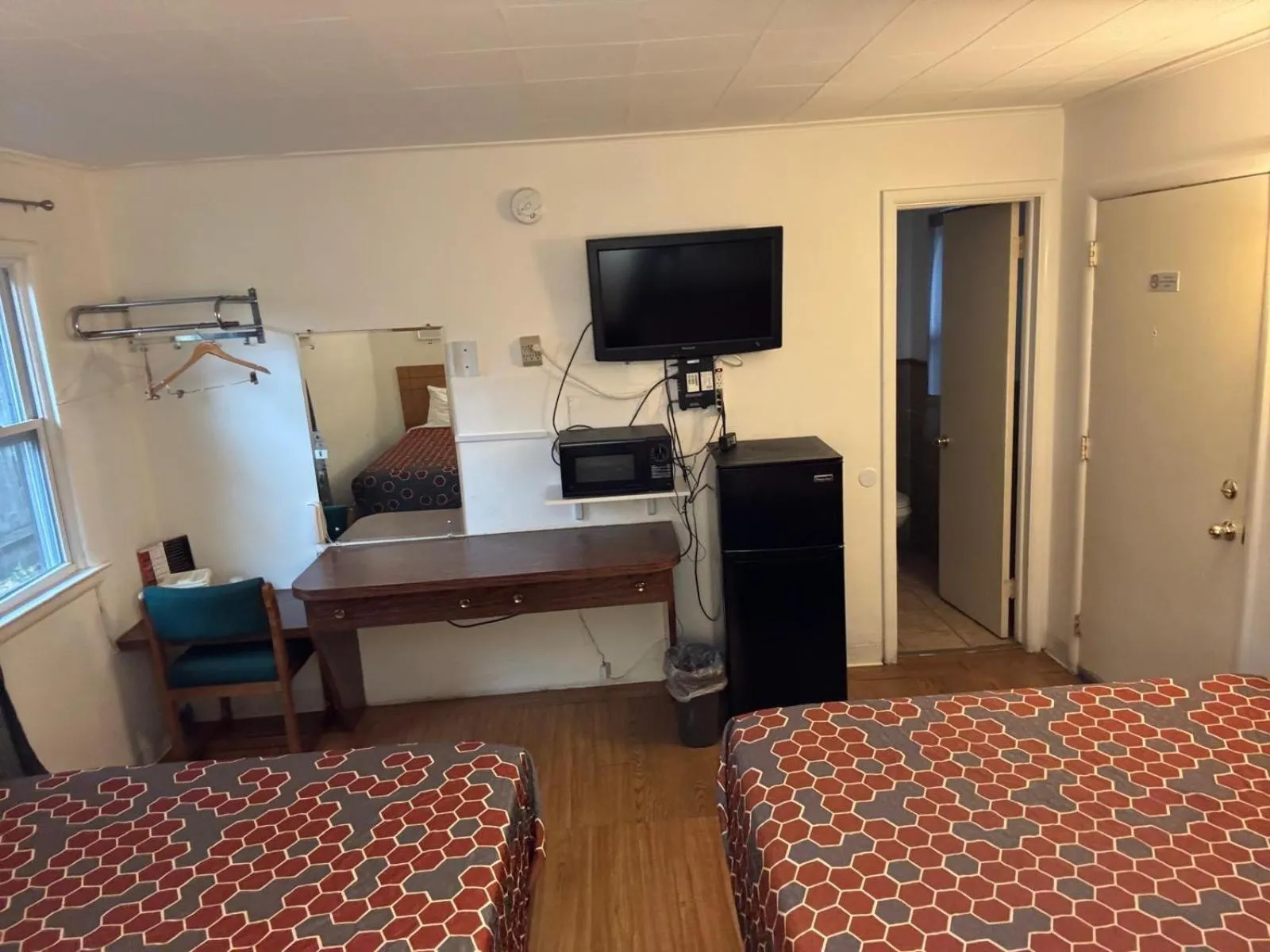 Bedroom, Bed in Economy Inn Cadillac MI by Hotel O