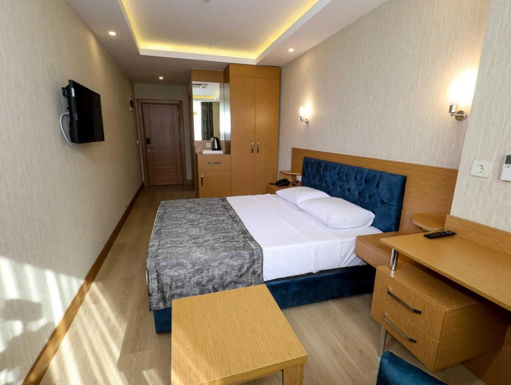 Bed in Grand Elmira Suites