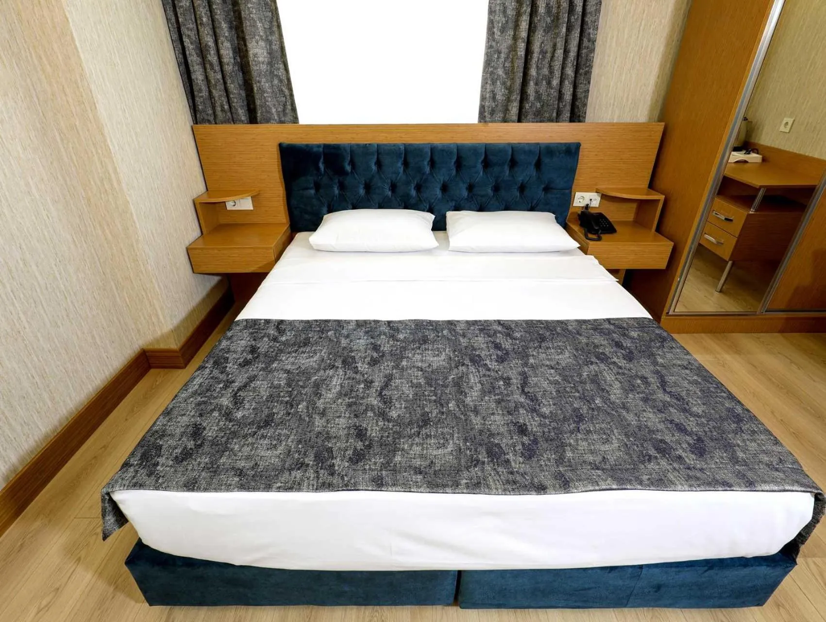 Bedroom in Grand Elmira Suites