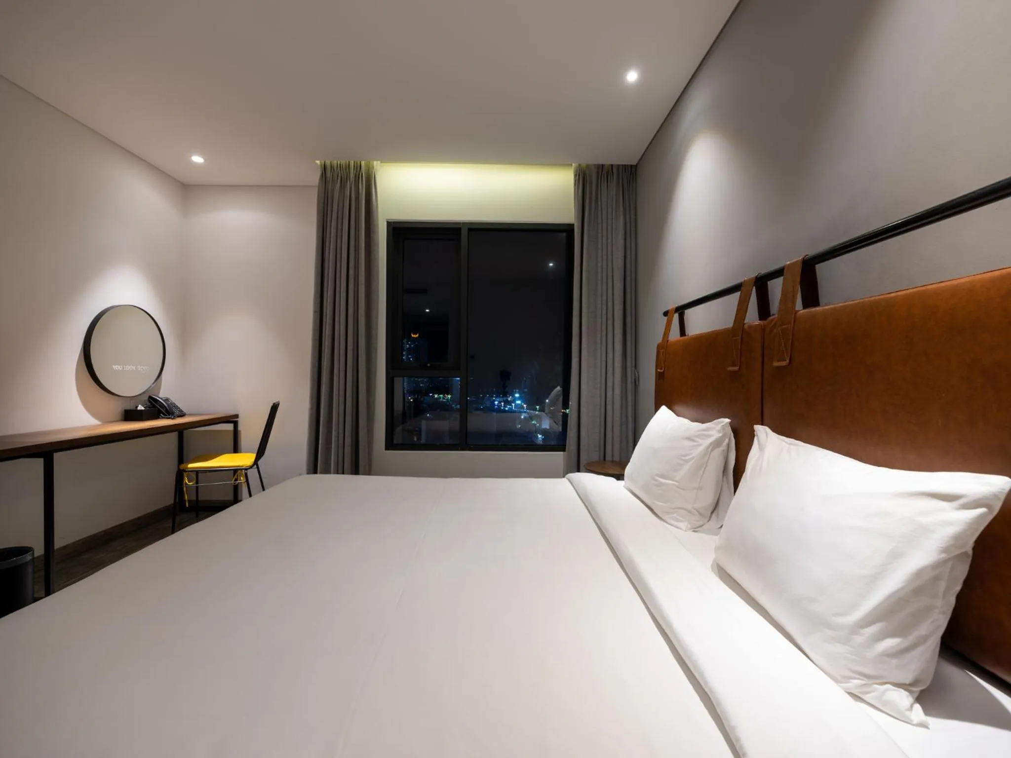 Bed in Em Oi Boutique Hotel