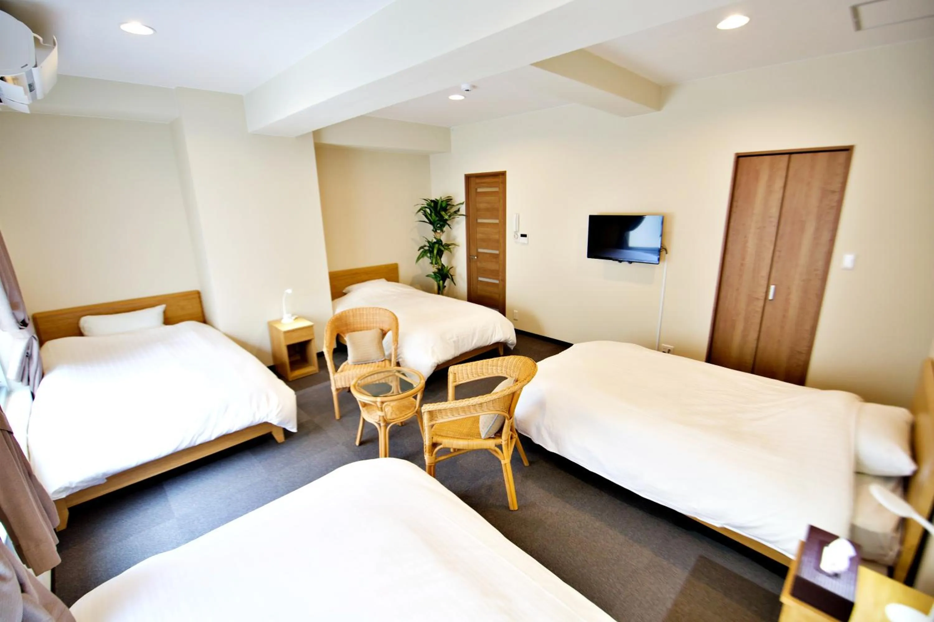 Bed in KURA HOTEL IZUMISANO