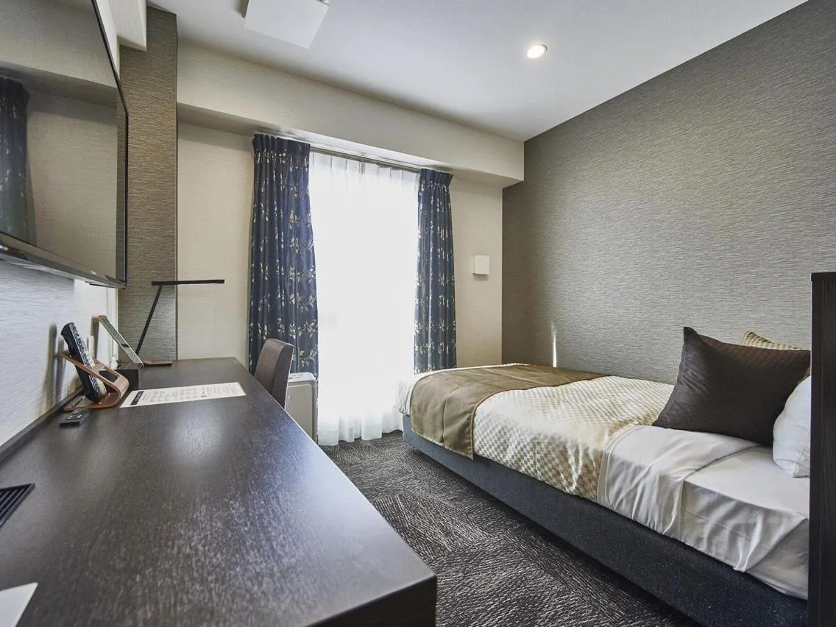 Bed in The Celecton Omiya Kaisoku Kitamoto Ekimae