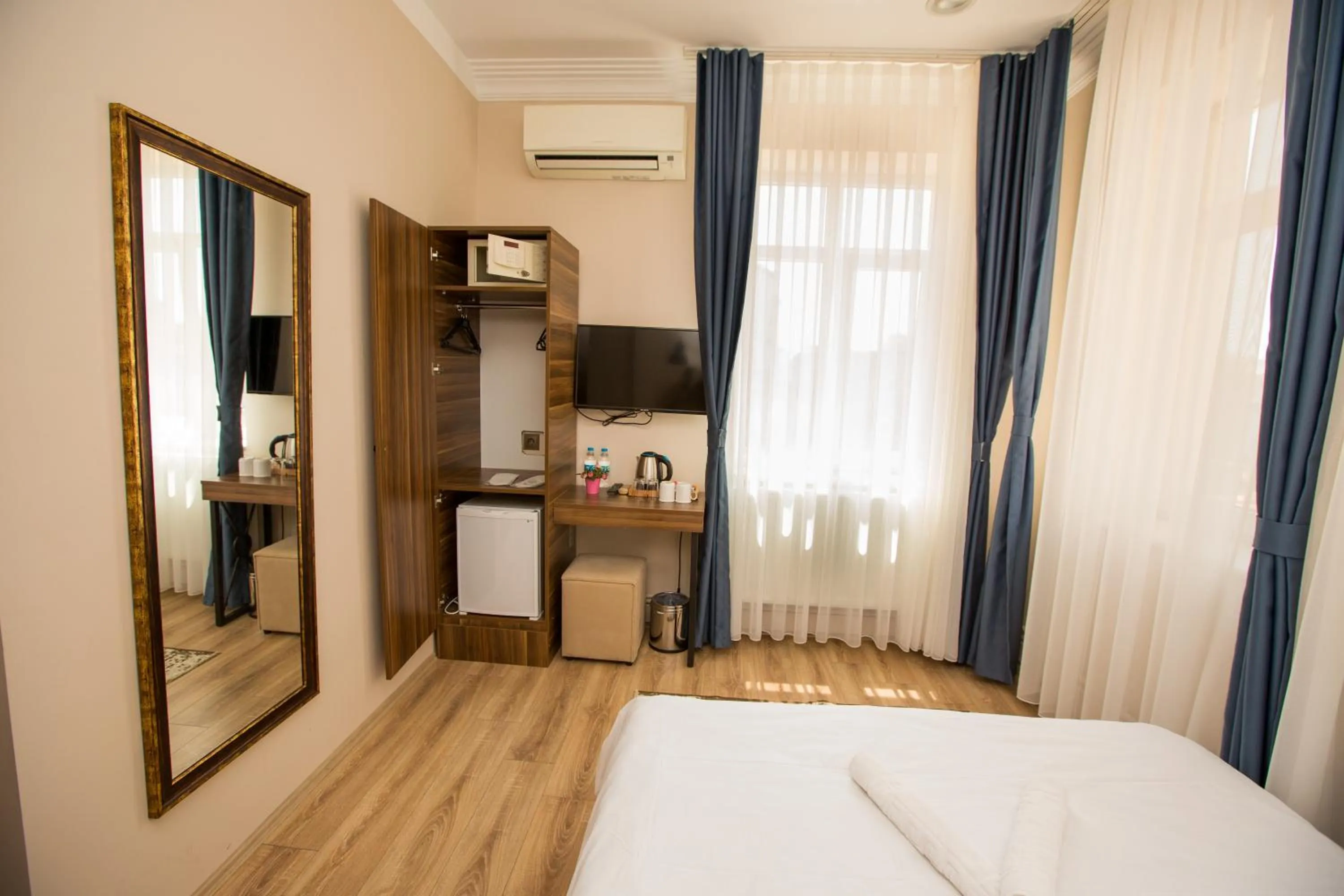 Bed in Corner Garden Hotel