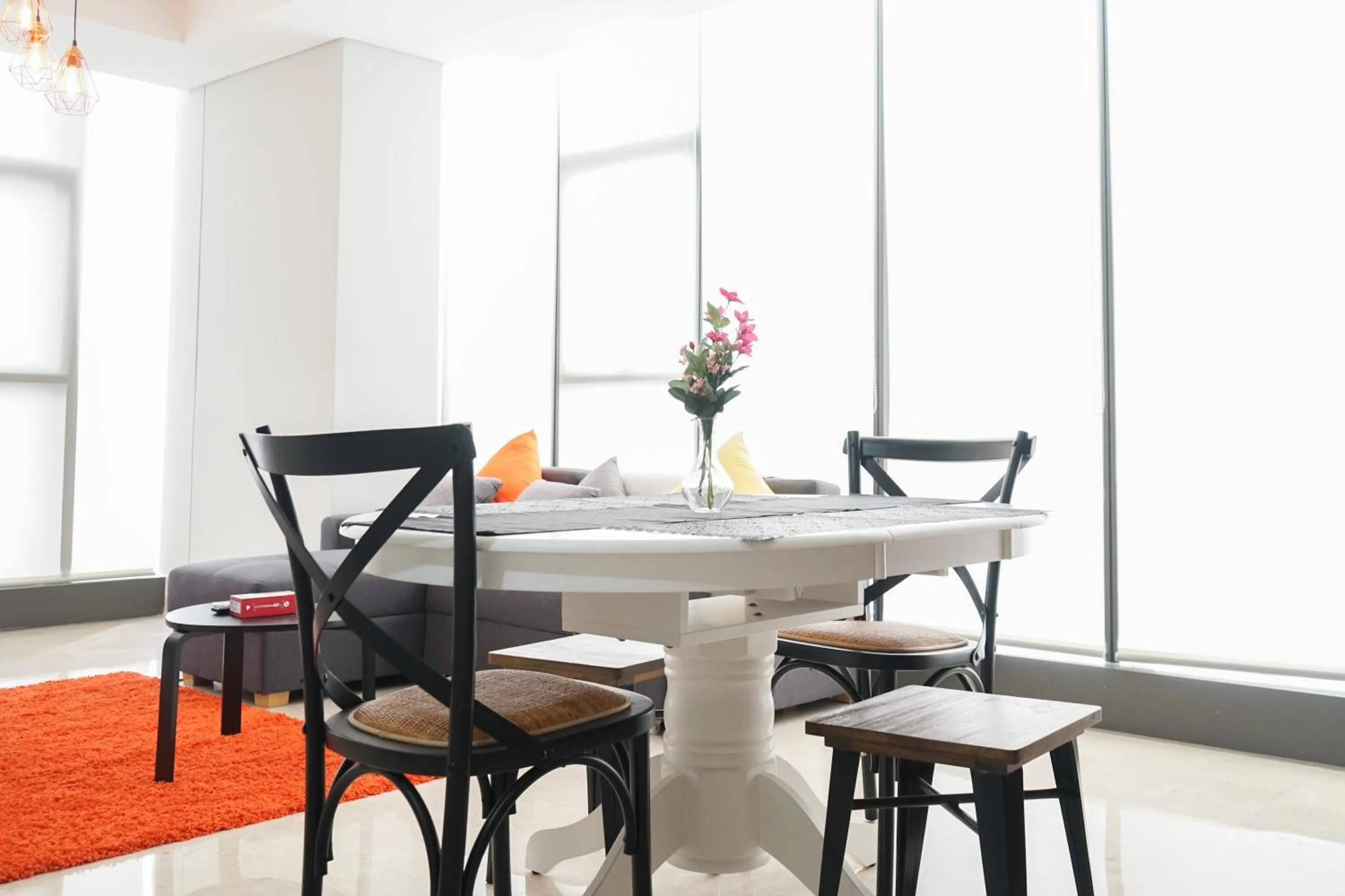 Dining area in South Tower 2BR at L'Avenue Apartment By Travelio