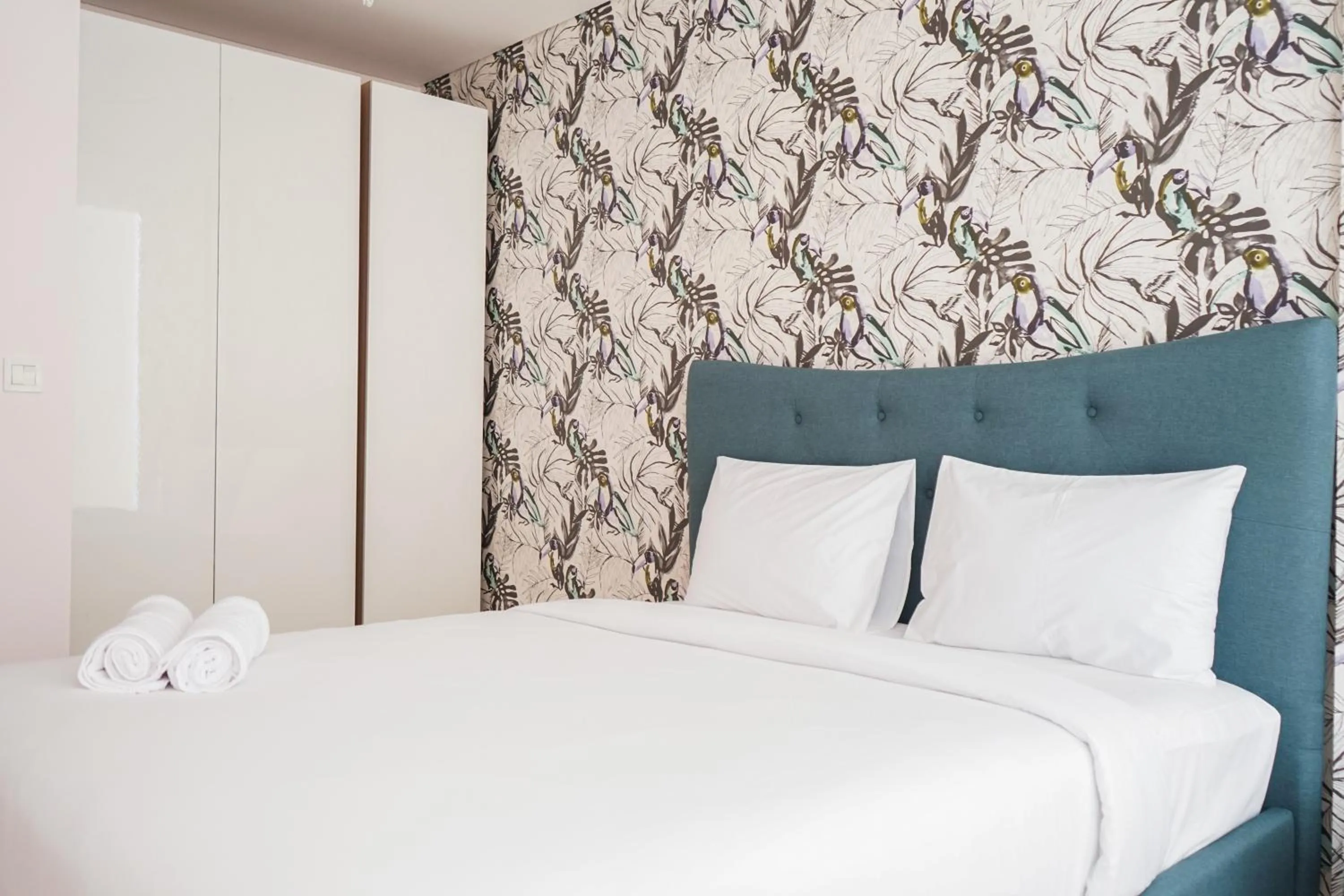 Bed in South Tower 2BR at L'Avenue Apartment By Travelio